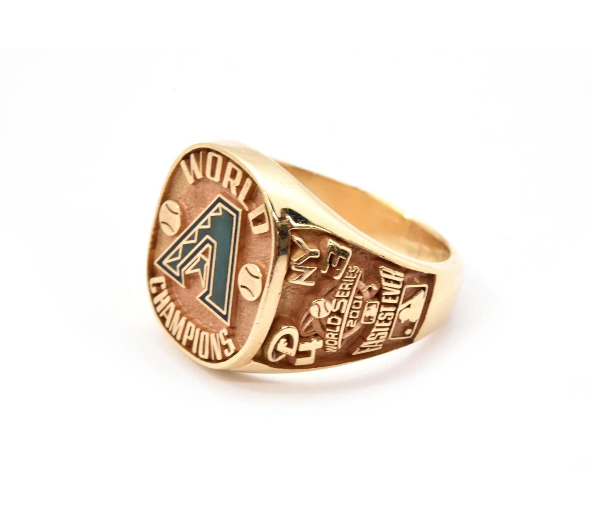 This is an authentic Arizona Diamondbacks 2001 World Series Championship ring for part team owner “Jorishie” made in 14k yellow gold. Detailed on one side of this award ring is “Fastest Ever” and the MLB logo along with the score of the