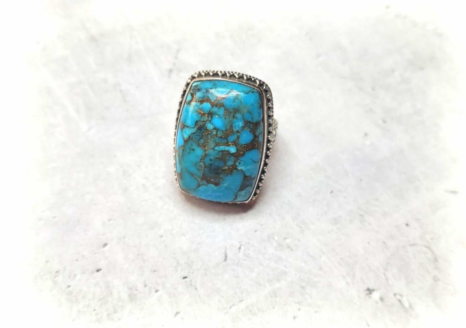 This beautiful, rare, comfortable ring is made from a high-quality Arizona Morenci turquoise cabochon in the sterling silver set.

The Morenci turquoise stone is approximately 26mm x 17.6mm
The US size of the ring is 7.
The weight of the ring is