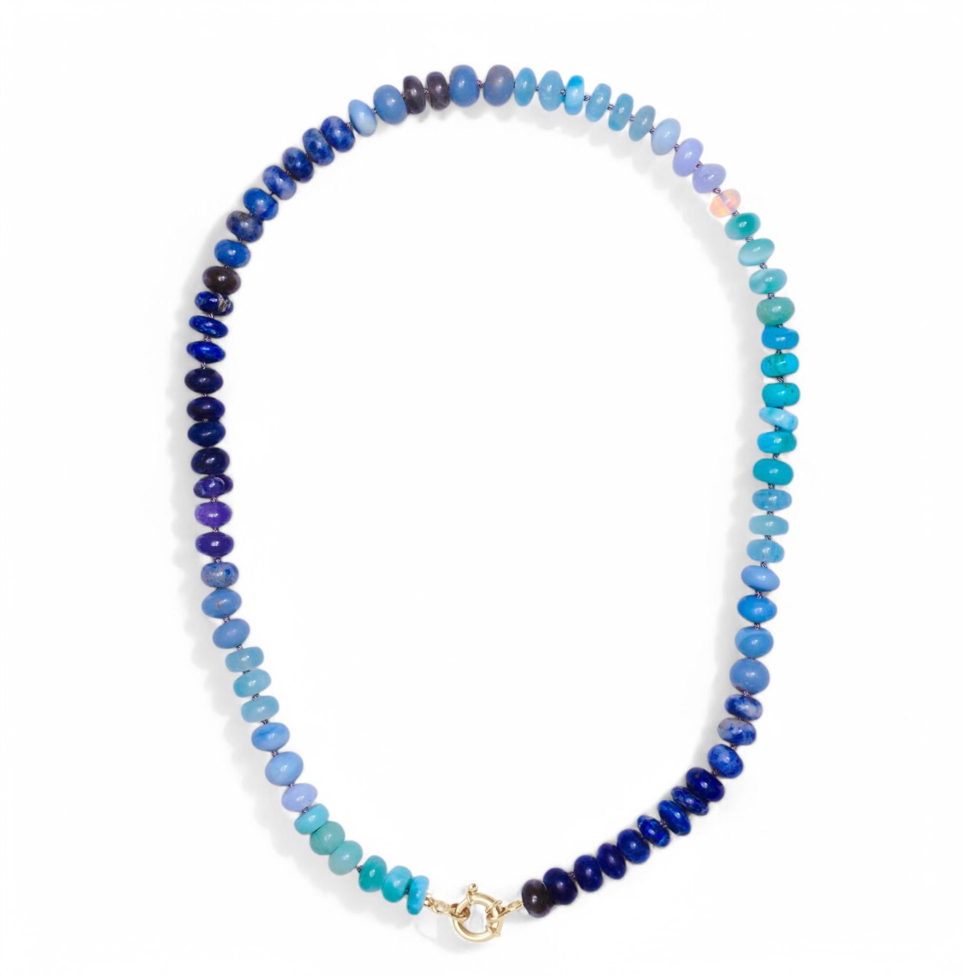 Flowy azure hues, like when the ocean kisses the shore. Capture the full spectrum of blue with this semi-precious multi gemstone necklace!

Gemstones included: 
• Ethiopian Fire Opal
• Rainbow Moonstone
• Opal
• Aquamarine
• Sleeping Beauty