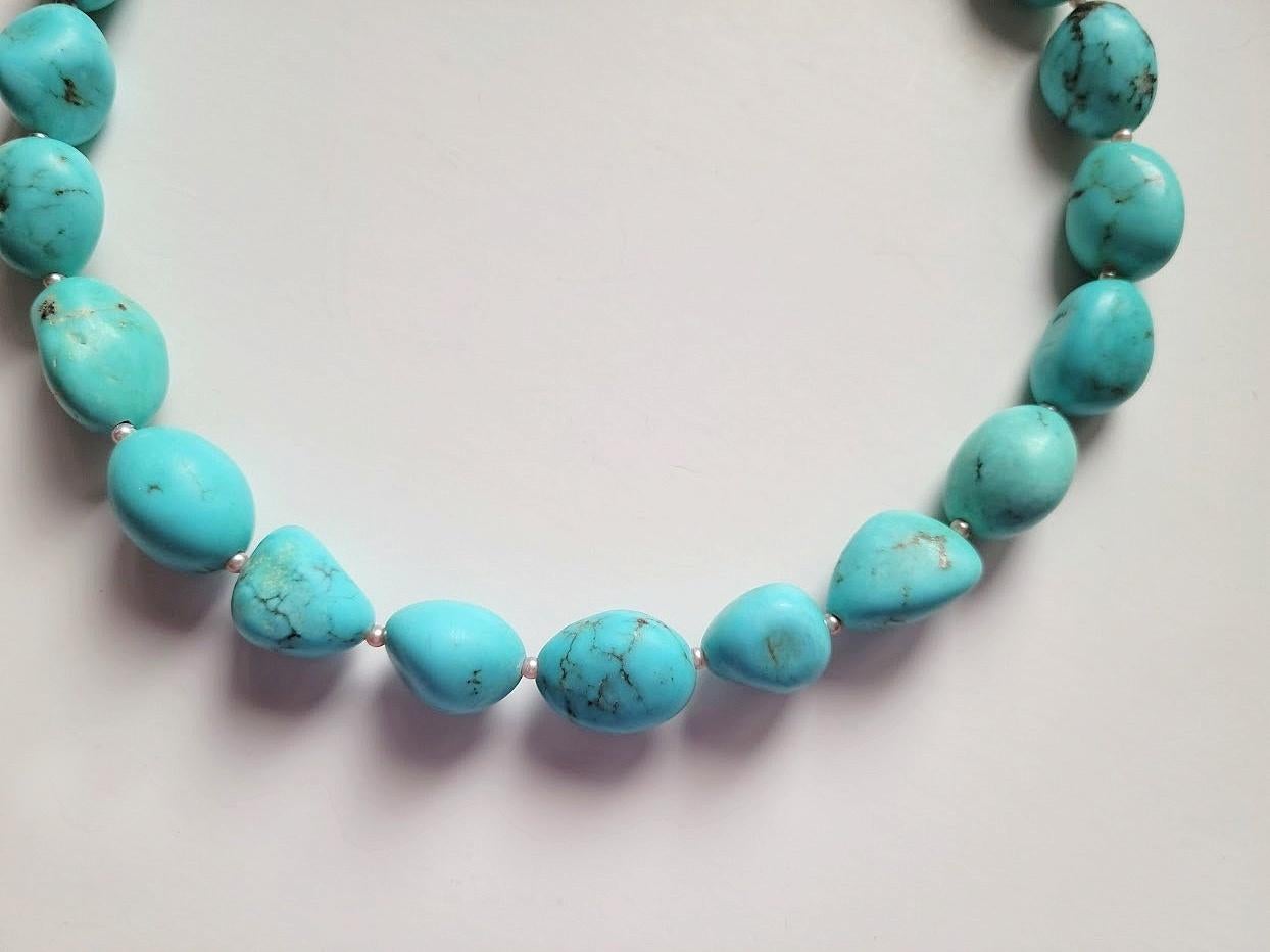 The length of the necklace is 18 inches (45.7 cm). The size of the irregular beads is 17-21 mm x 12-15 mm.
The color of the beads is bright, sky blue. In bright sunlight, a necklace of bright, shiny shade.
Genuine, stabilized, no color added, blue