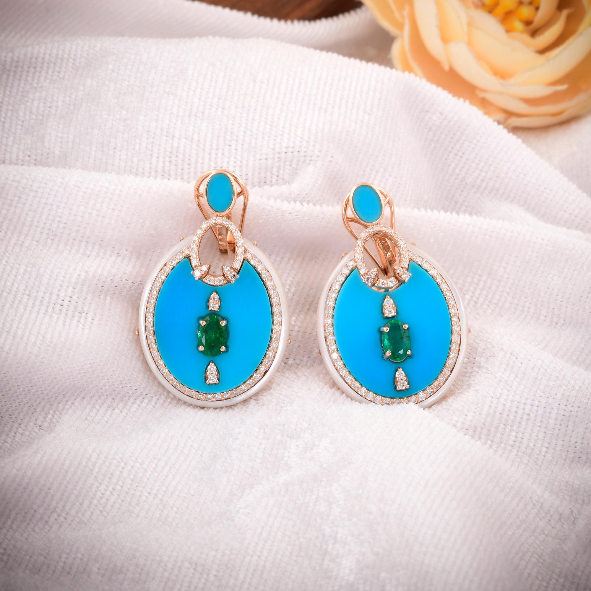 Adorn yourself with the captivating beauty of nature's treasures with these stunning Turquoise Mother of Pearl Dangle Earrings, accented by radiant Emeralds and Diamonds, all set in exquisite 14 Karat Rose Gold. These earrings are a true celebration