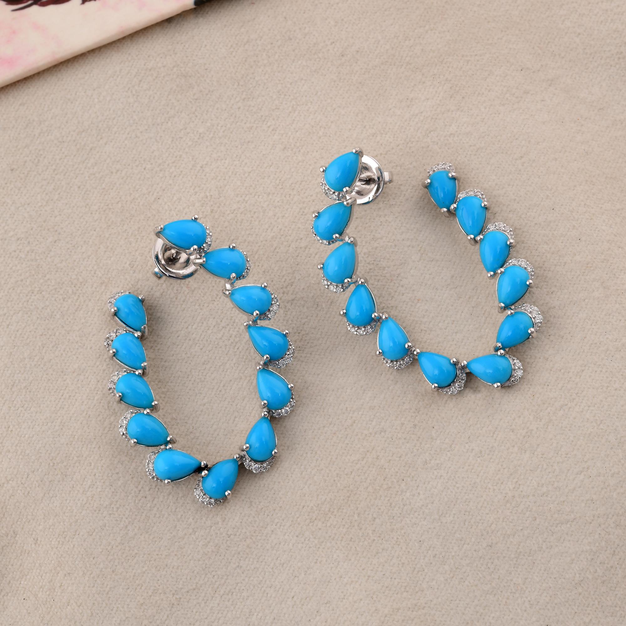 Cast from 18-karat gold, these exquisite earrings are handset with 7.93 carats Arizona turquoise and 0.35 carats of sparkling diamonds.

FOLLOW SPECTRUM JEWELS storefront to view the latest collection & exclusive pieces. Spectrum Jewels is proudly