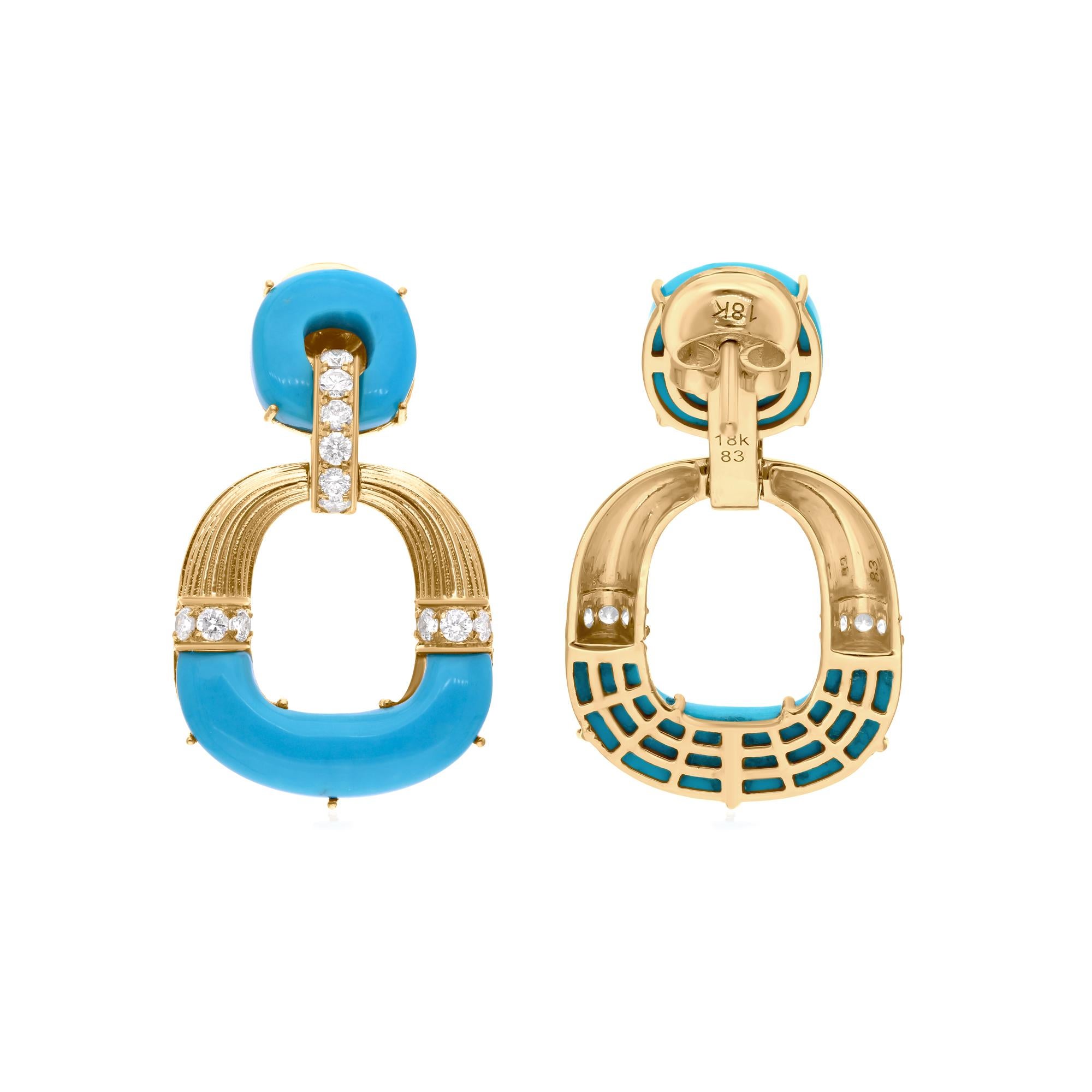 Add a touch of elegance and color with these stunning Arizona Turquoise Gemstone Dangle Earrings, crafted in 14 Karat Yellow Gold. Featuring 9.43 carats of vibrant Arizona Turquoise and accented by 0.75 carats of sparkling natural diamonds with an