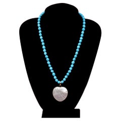 Arizona turquoise necklace with a mother of pear removable center