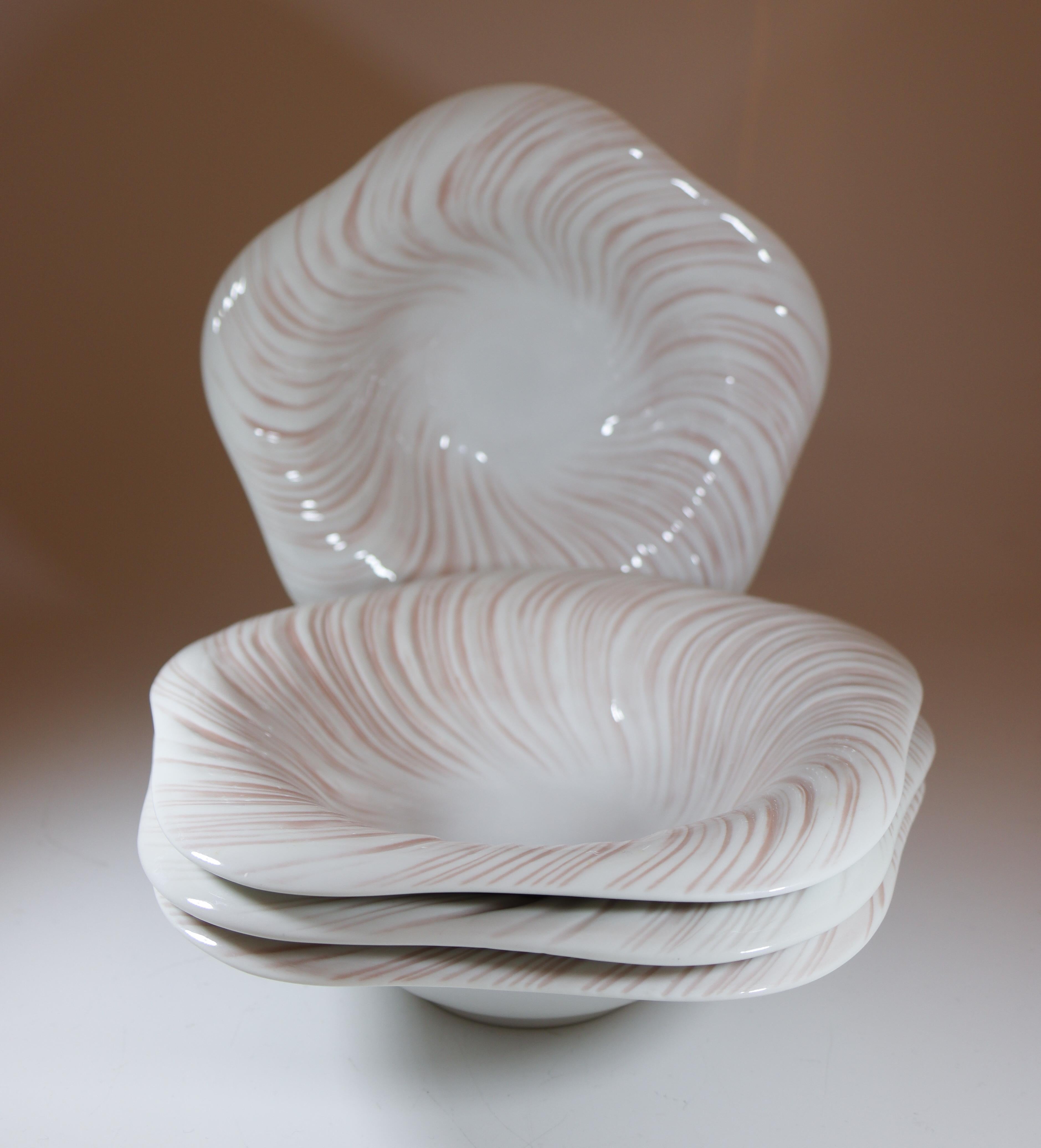 4 Deep Plates of model Royal Copenhagen Konkylie Triton Rosa designed by Arje Griegst in the late 1970s and also produced between 1975-79. The plates are 21 cm in diameter and in excellent condition except from some minor scratches on the inside.