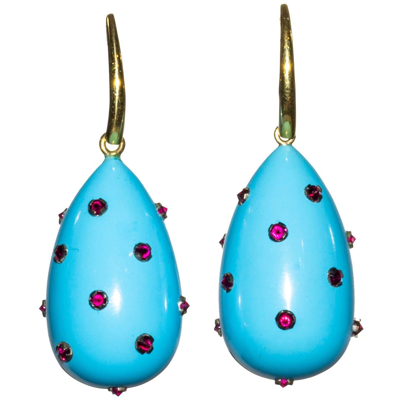 These elegant earrings are inspired by renaissance jewelry that had small stones incrusted into the piece. These earrings are carry 60 carats of Sleeping Beauty Turquoise that has been carved into a large drop.  It is incrusted with 1.53 carats of