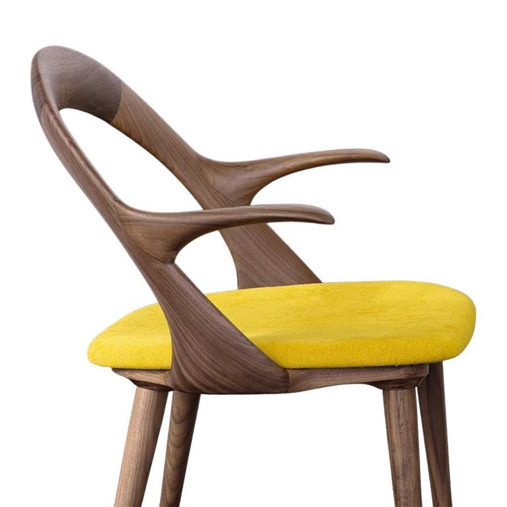 Chair Ark Walnut armrests with structure in solid walnut wood
with armrests included, seat upholstered and covered with high 
quallity velvet fabric (Cat. C) in yellow color.
Also available with other fabrics, on request.