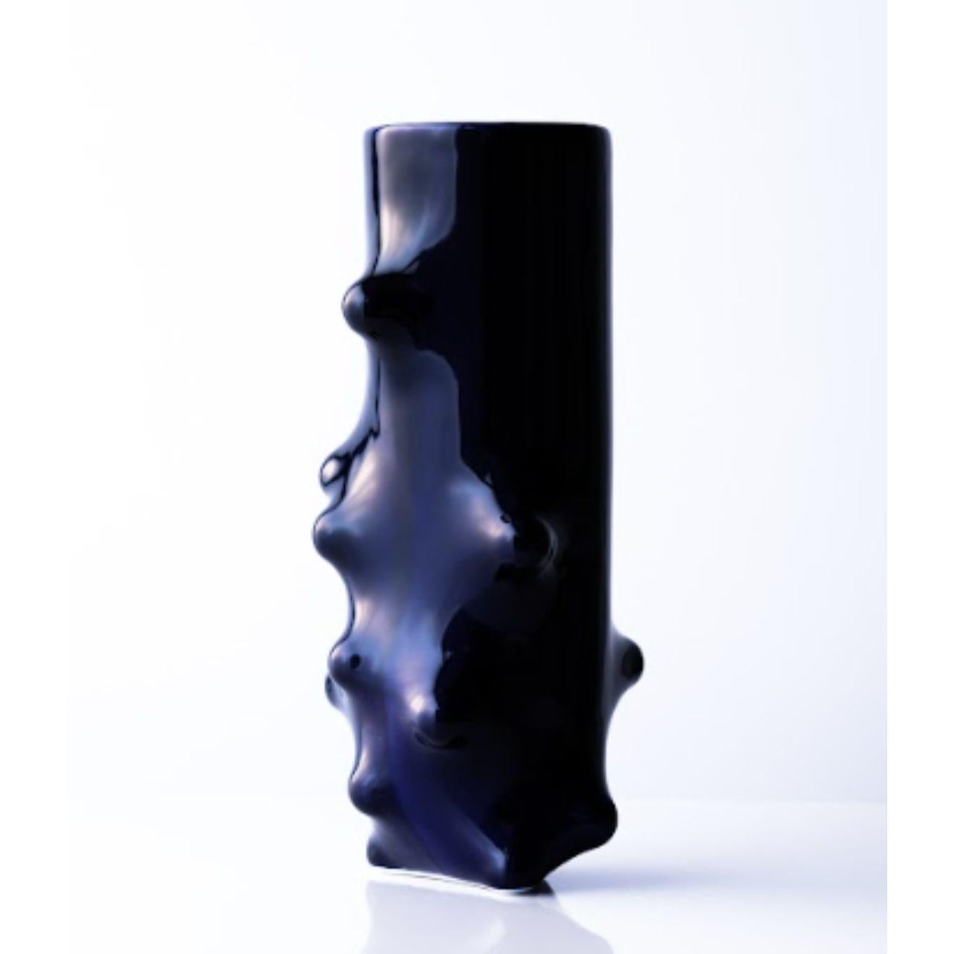 Arkadiusz Szwed bumps 2.0 vase Long by Nów
Designed by Arkadiusz Szwed
Dimensions: D 30 x W 14 x H 14 cm
Materials: glazed porcelain, cobalt

BUMPS 2.0 is a set of ceramic objects that were created as a result of an experiment with a new,
