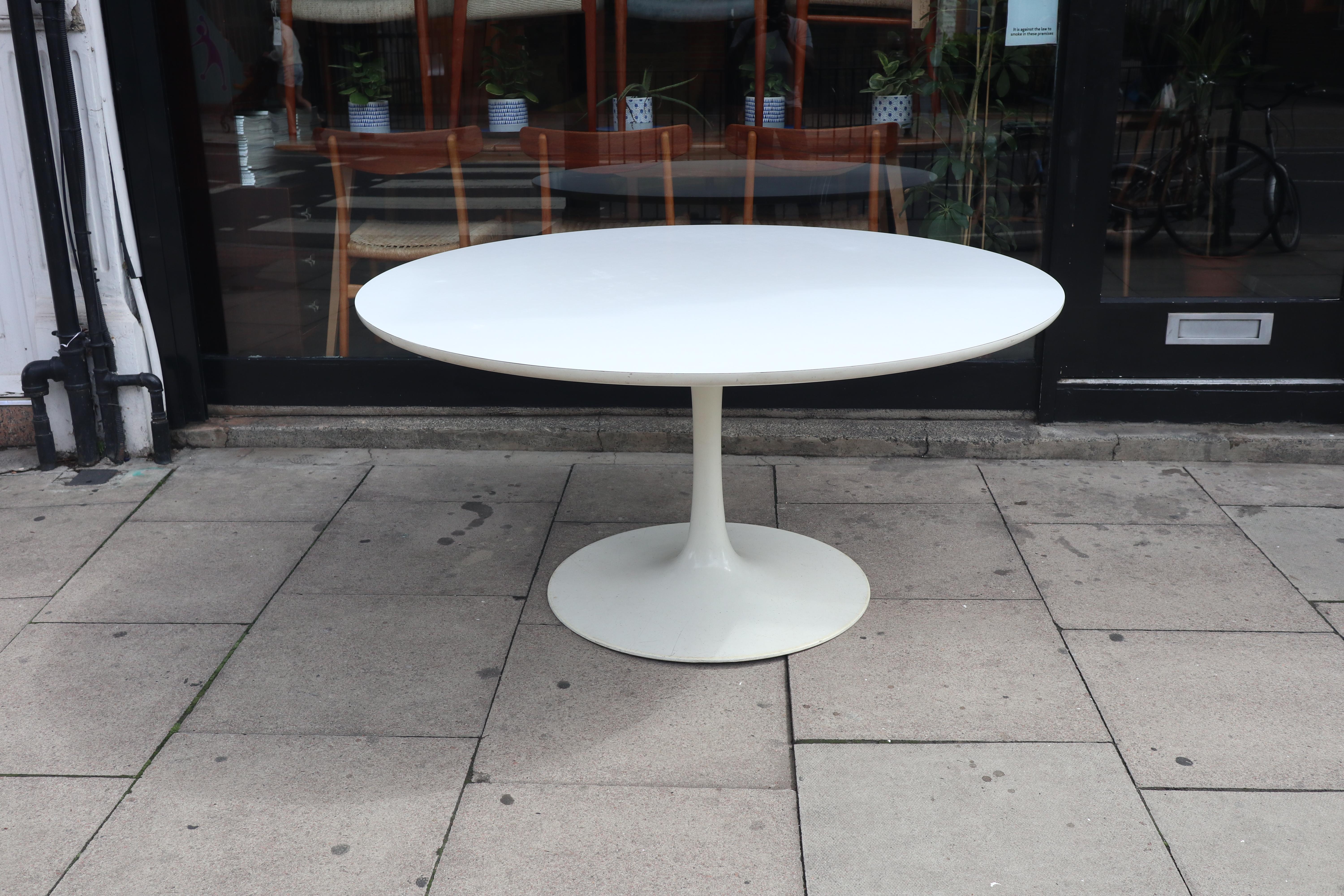 Maurice Burke for Arkana Tulip White Circular Dining Table With Arkana Branded Stamp Mid Century Modern 1960's.  The white laminate top and cast aluminium circular tulip base of this dining table is a mid 20th century design classic. And with the