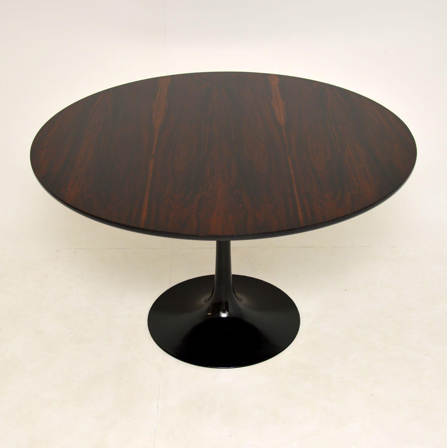 A stunning and very rare vintage dining table, designed by Maurice Burke for Arkana. This was made in England, it dates from the 1960’s.

This rare version has a stunning circular wood top, and we have just had the base ebonised.

The top has