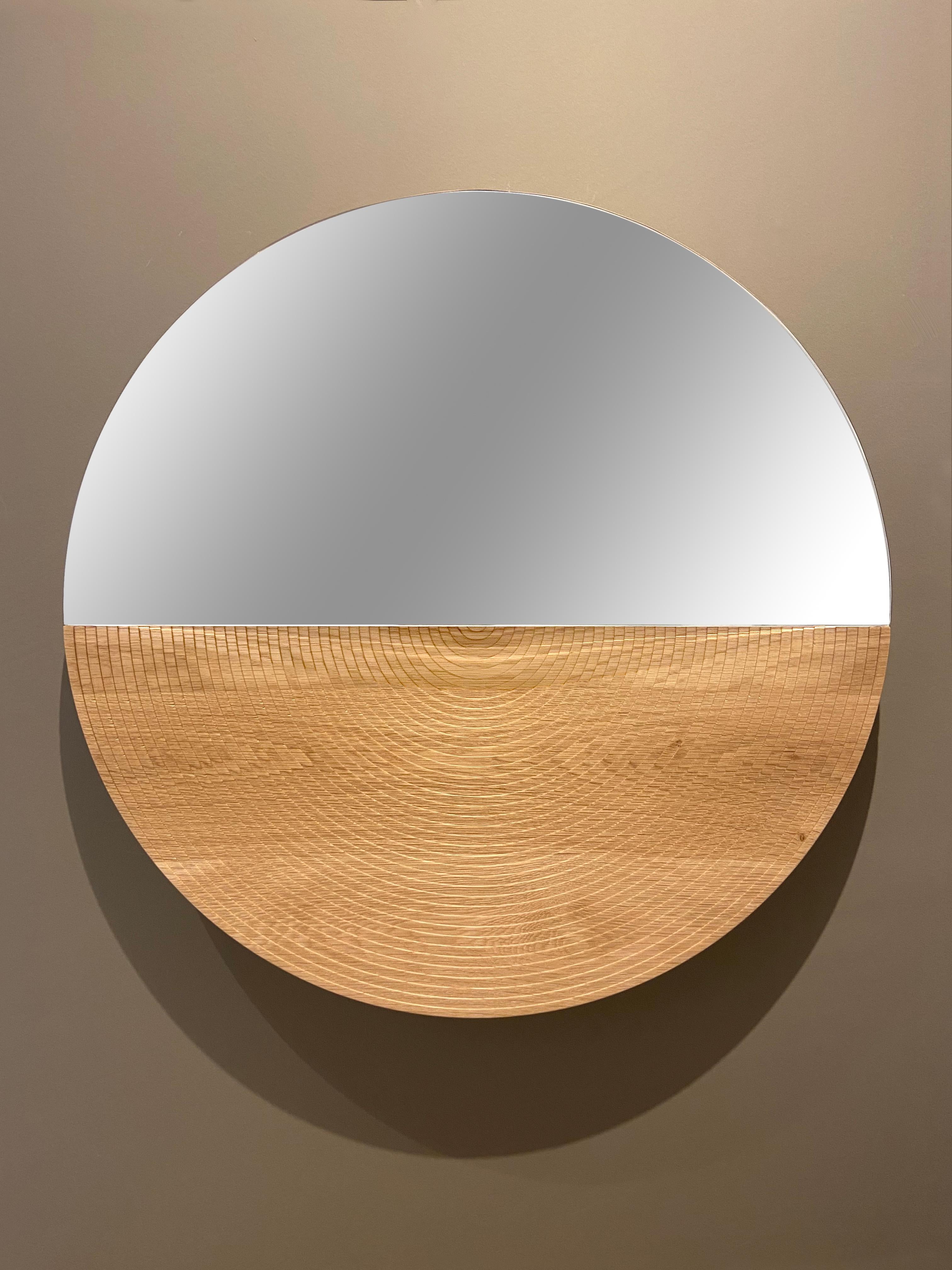 Arkhe mirror table is a graceful combination of functionality, simplicity and sculptural posture. The natural beauty of oak, exquisite craftsmanship and the inspiration coming from stunning amphitheaters of old times gives this mirror its timeless