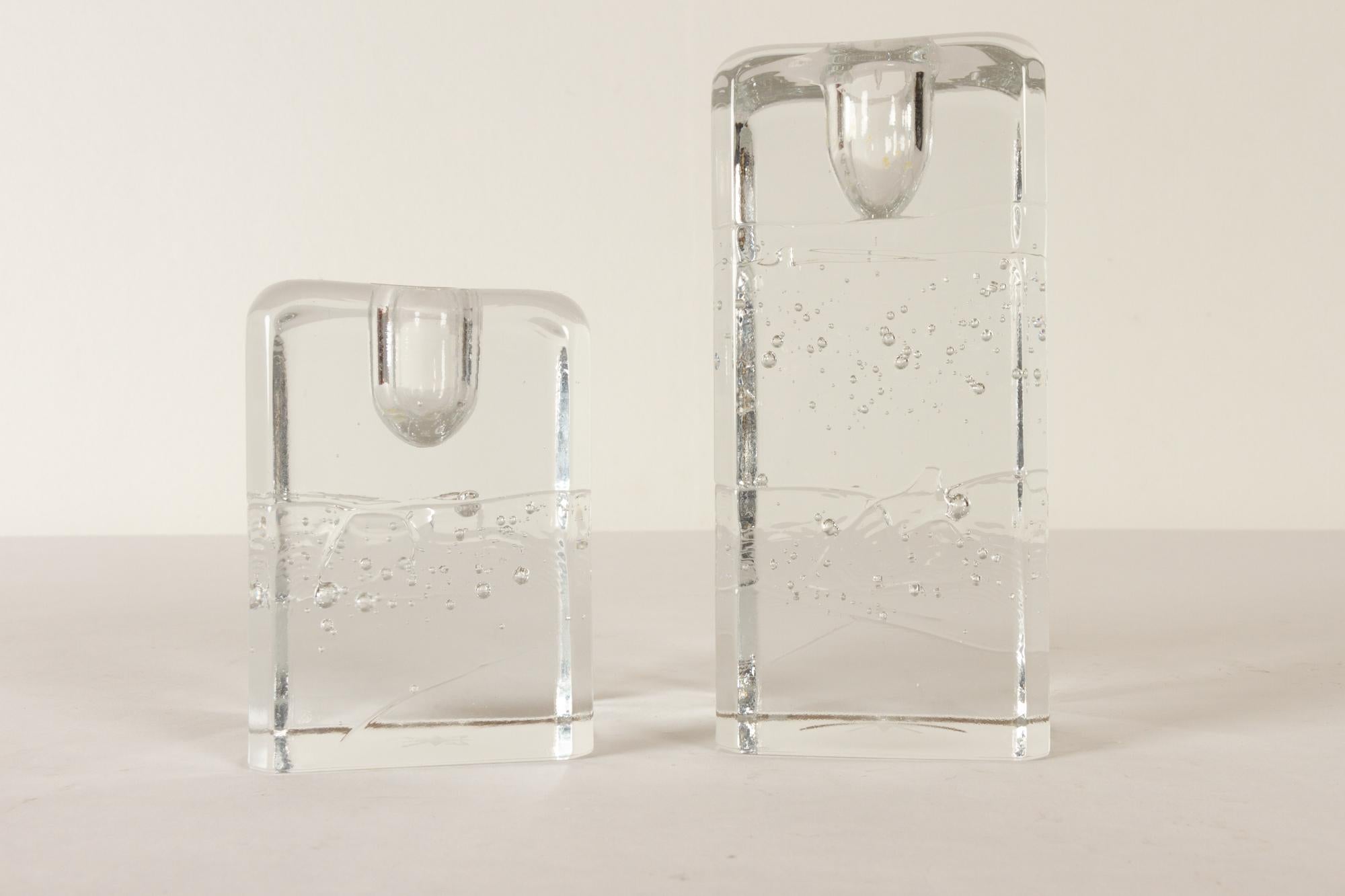 Arkipelago candlesticks by Timo Sarpaneva for Iittala, 1970s, set of 2
Pair of candleholders in clear crystal cast glass with air bubbles inside. They were created to appear as they were blocks of ice. Designed in the 1970s by Timo Sarpaneva in