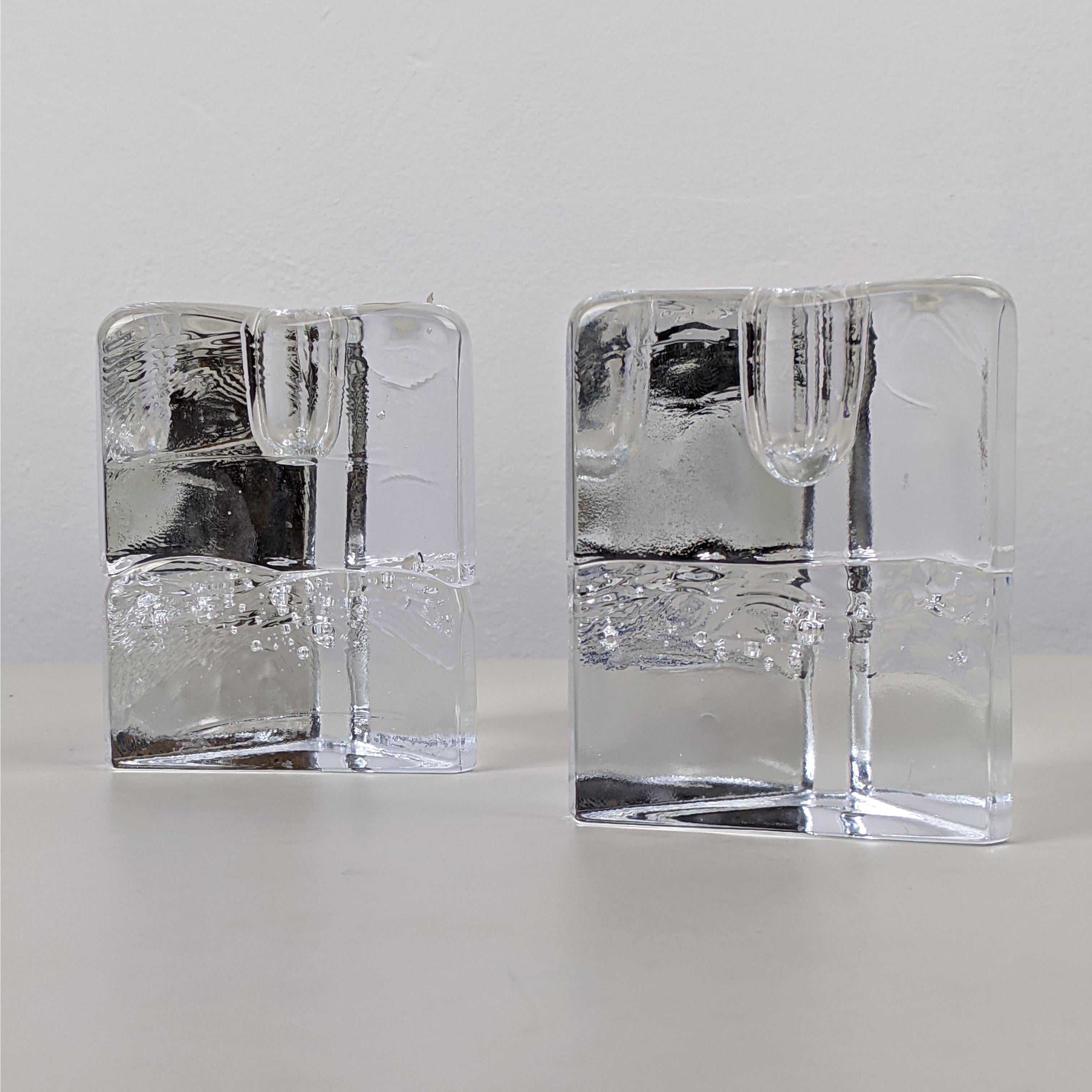 Timo Sarpaneva for Iittala, c. 1970
‘Arkipelago’ triangle candle holders, pair 

Clear blown glass
Excellent condition

Dimensions, each approx..:
w 7cm, h 8.7cm, weight 550g.