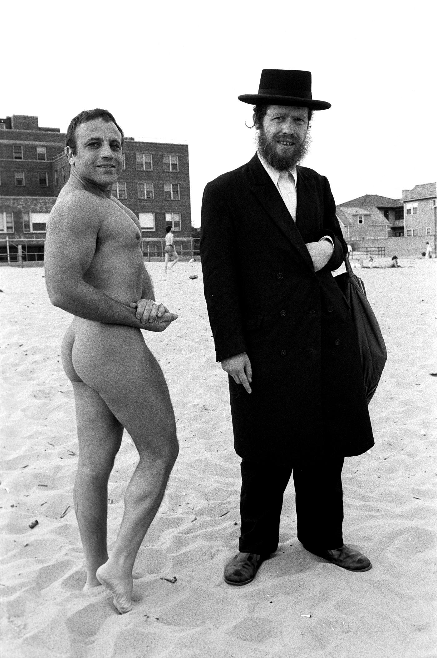 Hassid & Jewish Bodybuilder, Coney Island, NY - Photograph by Arlene Gottfried