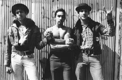 Three Guys in Front of a Wall