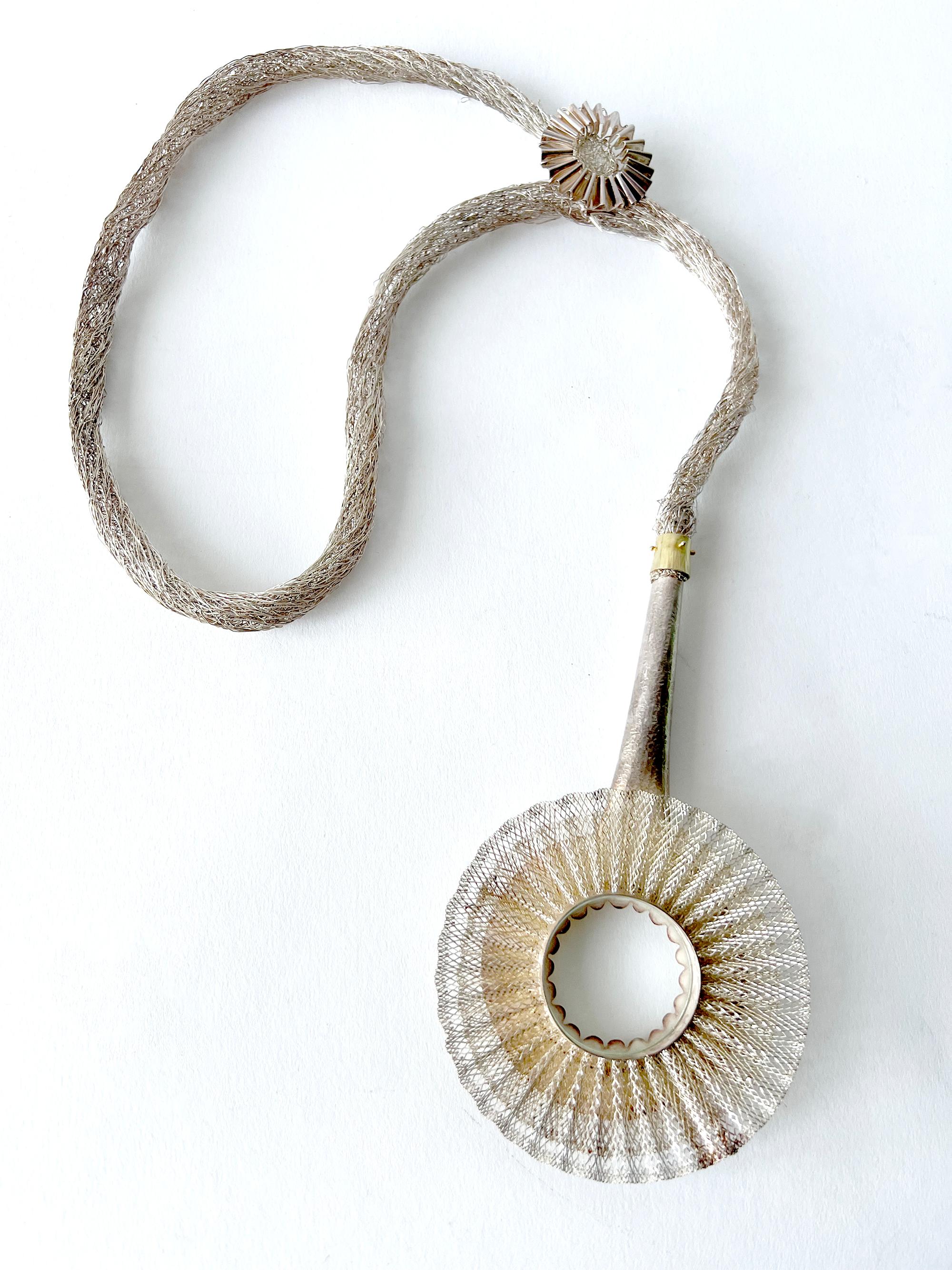 Rare, hand crocheted sterling silver sautoir with fluted gold vermeil magnifying glass monocle created by Arline Fisch of San Diego, California.  Piece measures 33.5