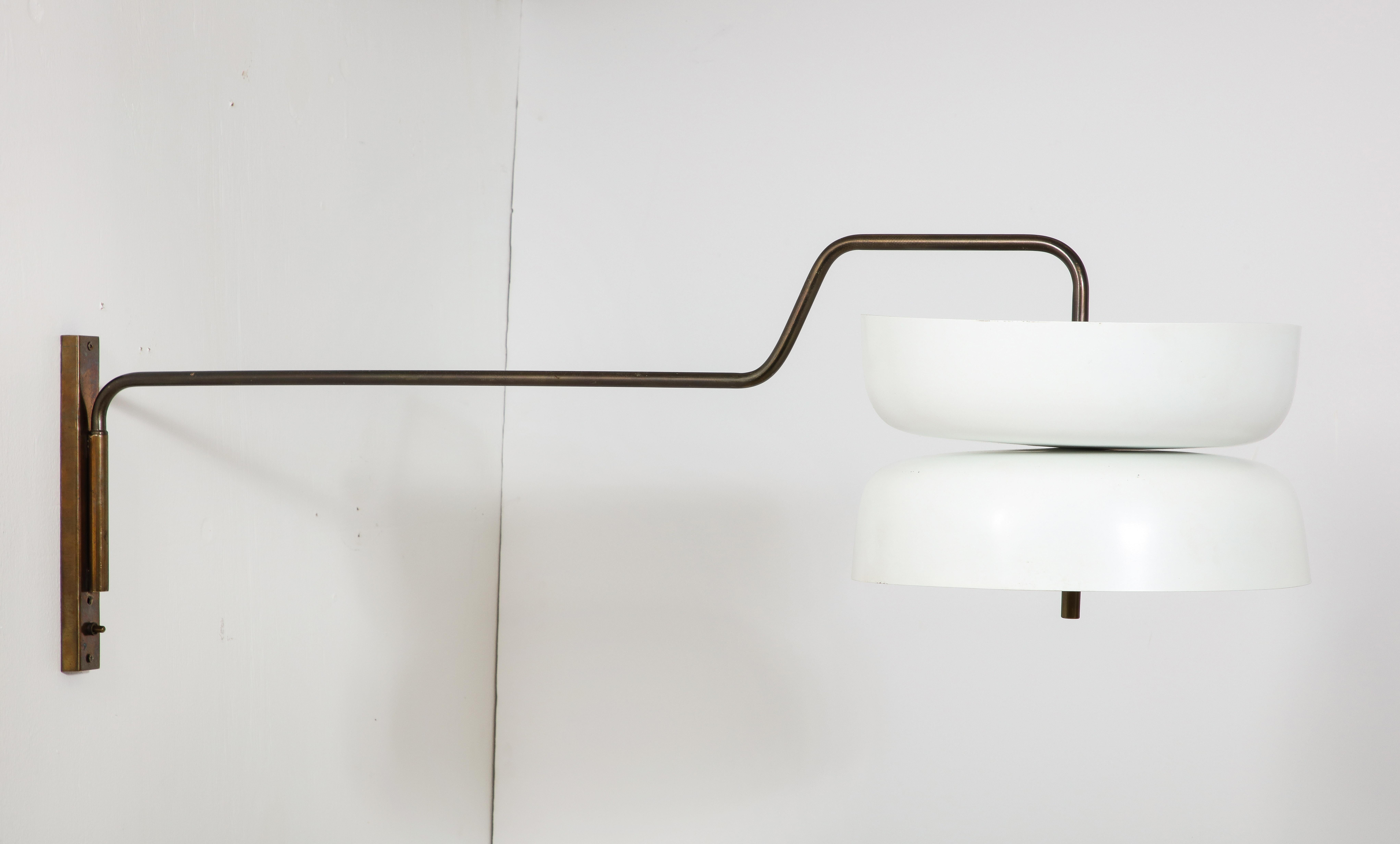 Two-tone patina steel and brass swing arm sconce with a dual reversed shade, light up and down.

48x15x16