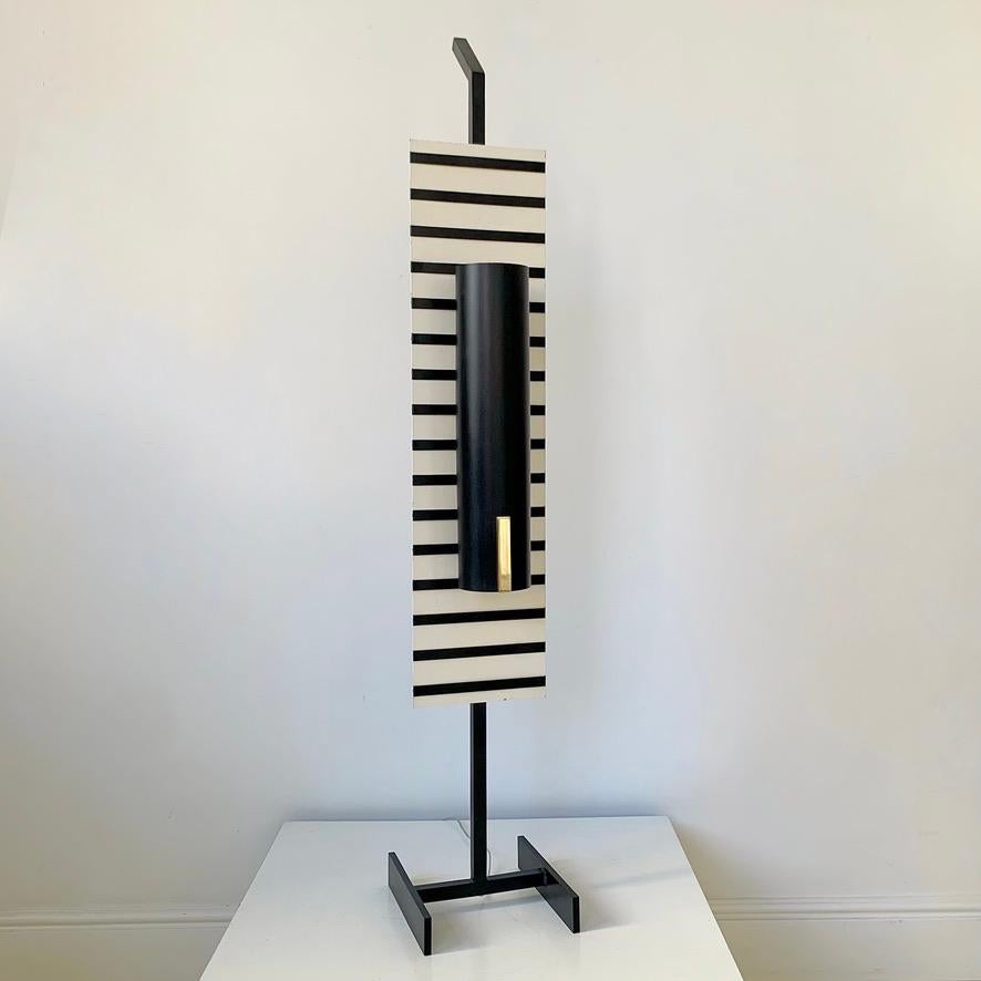 Rare mid-century Arlus floor or table lamp, circa 1960, France.
Black and  white striped laquered metal, brass details.
Rewired. Two E22 bulbs.
Dimensions: 103 cm H, 18 cm W, 24 cm D.
Collector lamp in good original condition.
All purchases are