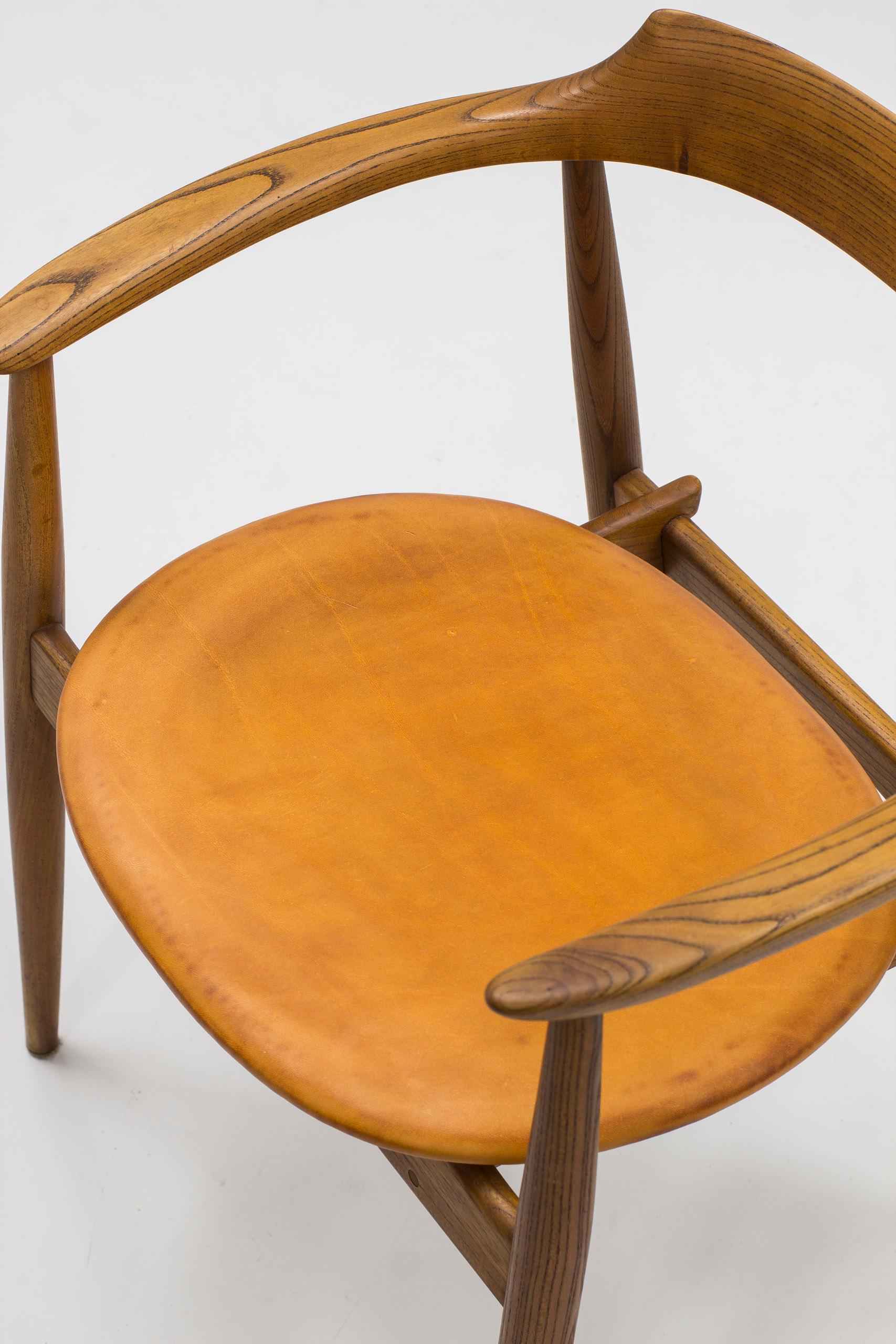 Leather Arm chair in elm and leather with exquisite patina by Arne Wahl Iversen, 1960s For Sale