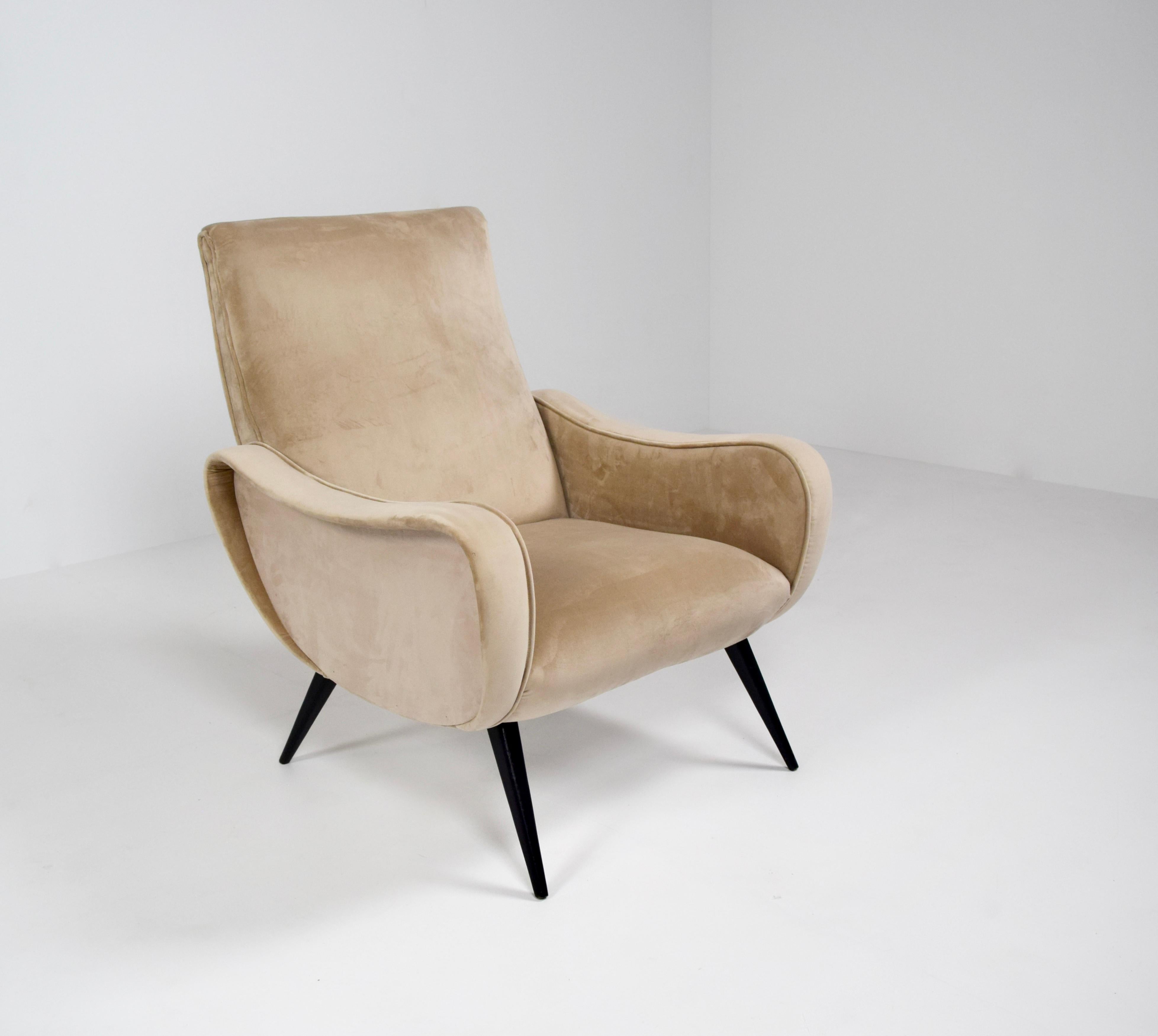Amazing armchair in Lady Style by Marco Zanuso, Italy 1960s. This chair is very elegant, especially the armrests have a unique shape. The chair is in perfect condition. It is newly upholstered in a beige velvet fabric, which results in a luxurious