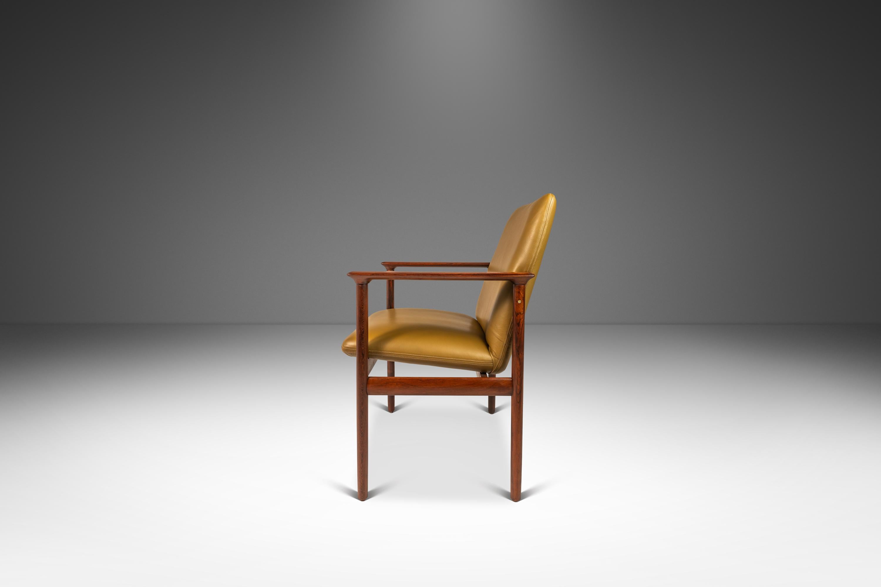 Introducing a rare, Dutch-made armchair produced by the lauded Amsterdam-based De Klerk & Sons. Built from a frame of solid Brazilian rosewood with stunning, variegated woodgrains unique to the rare hardwood this chair has been recently and
