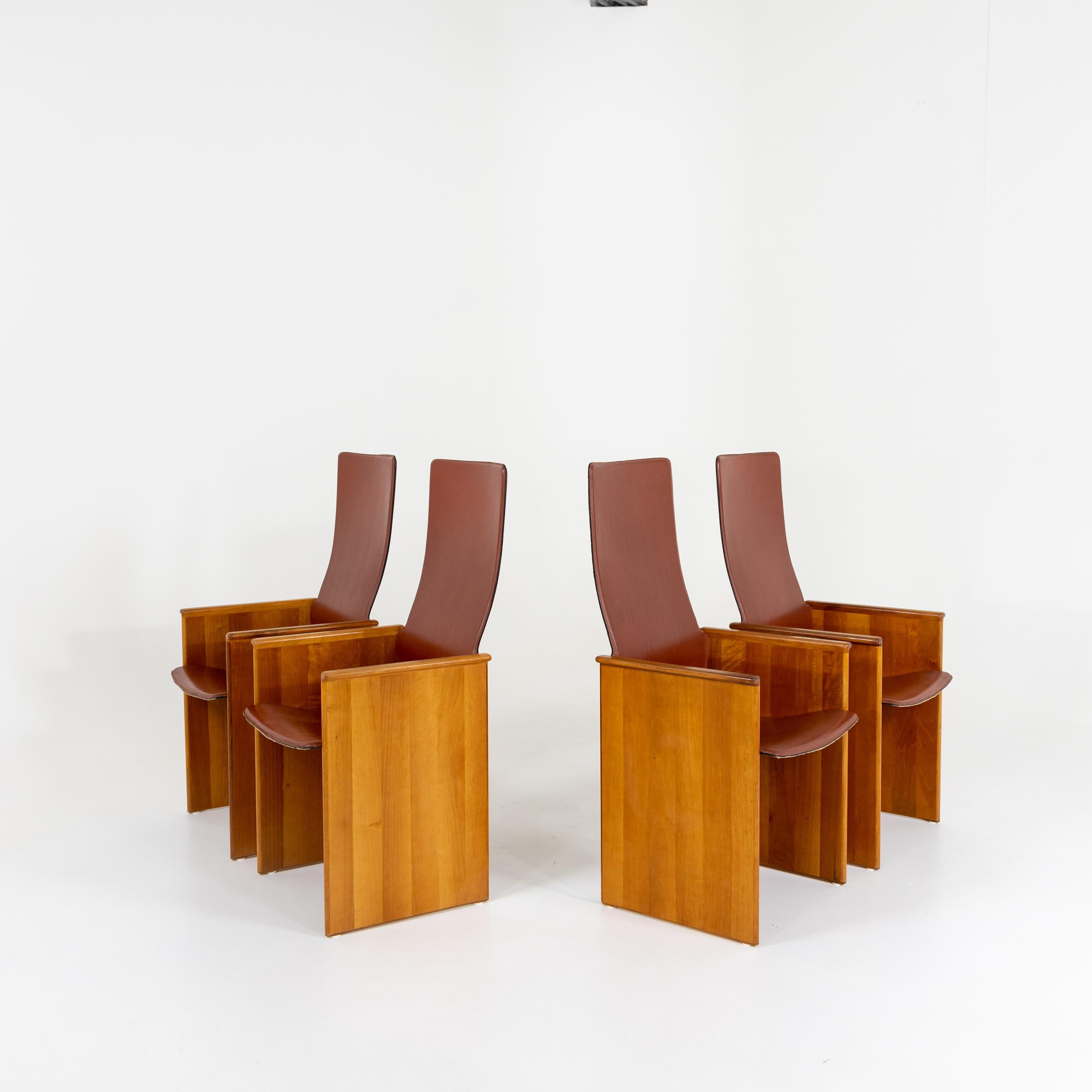 Set of four arm chairs with seats covered in brown leather designed by Afra and Tobia Scarpa for Stildmous 1964.

 