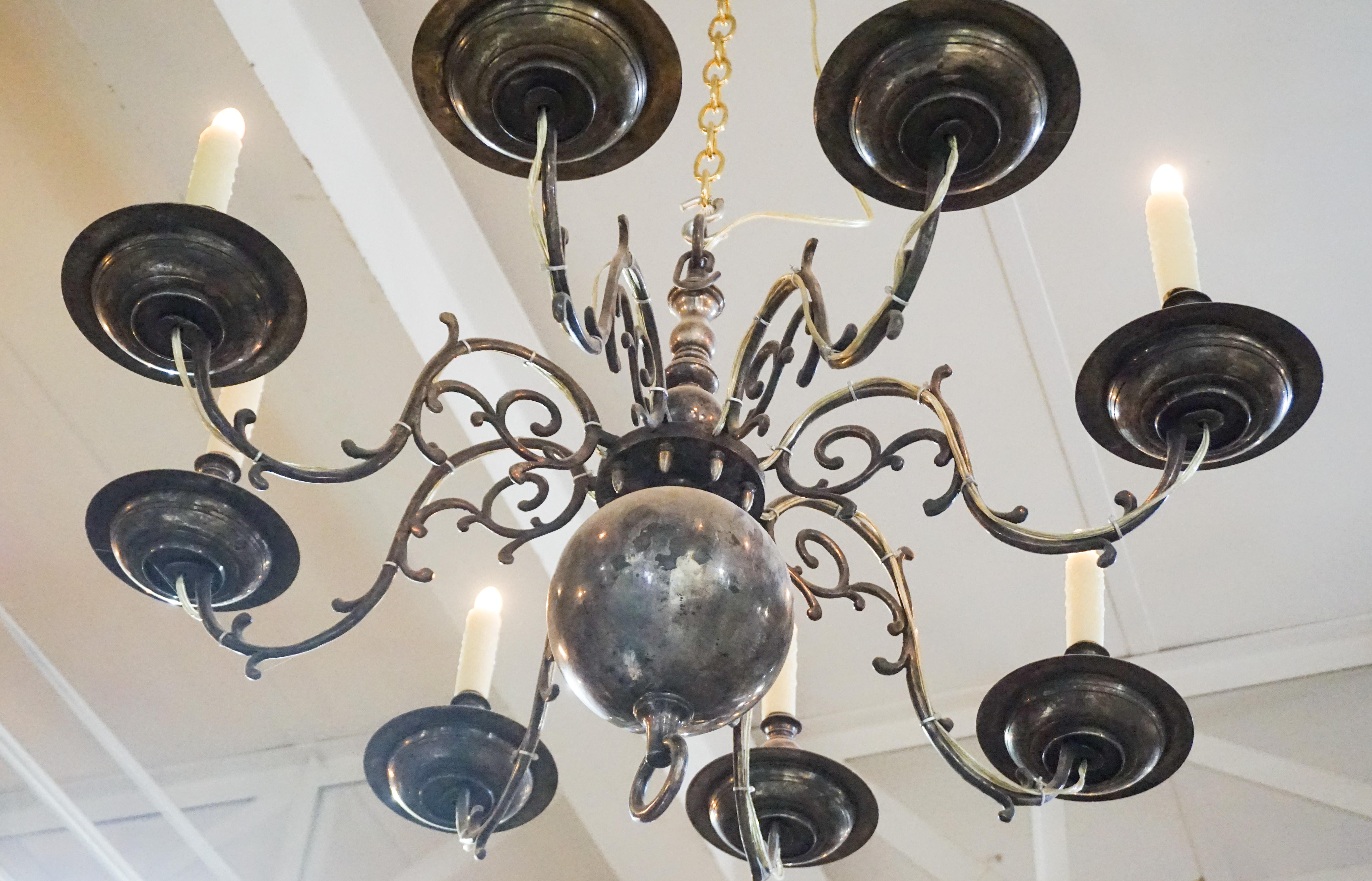 This antique chandelier is of Dutch origin and features eight lights. Ready for install.

Measurements: 37.5