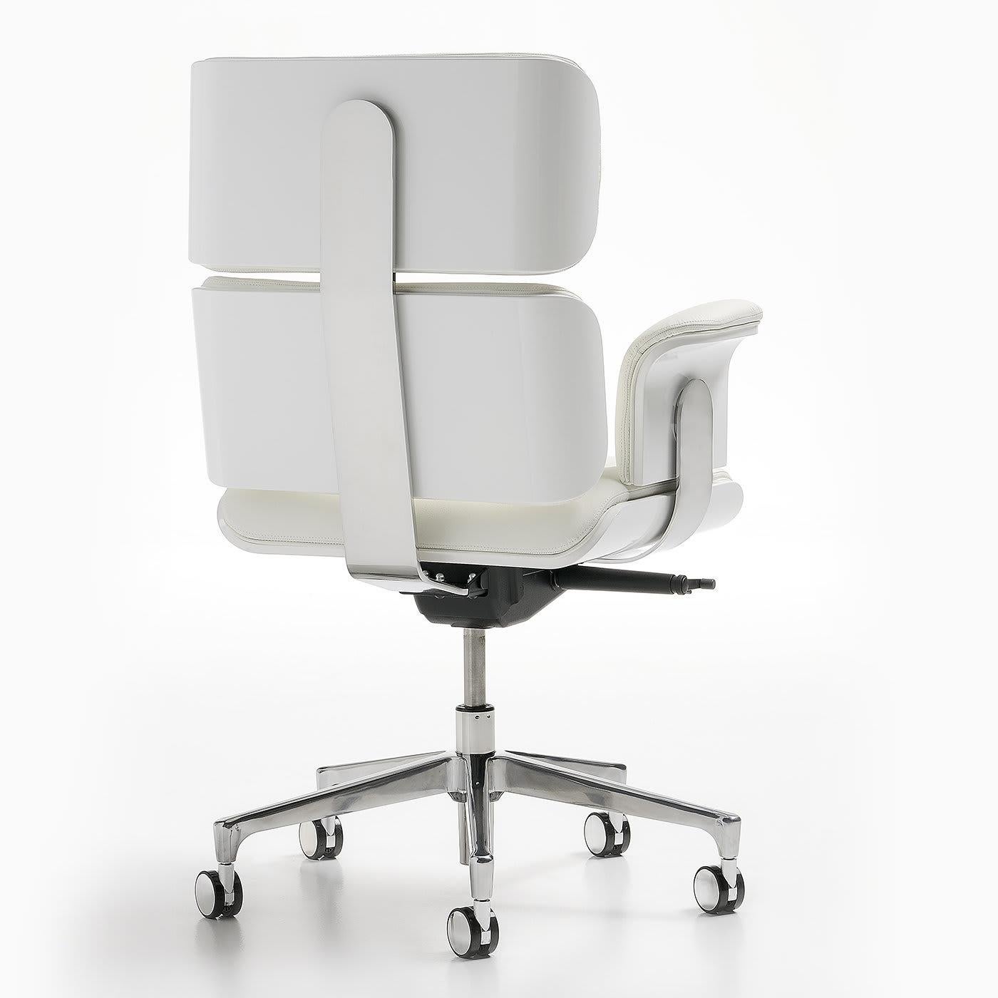 This luxury armchair is covered in white, genuine leather with Swarovski crystal buttons. Its seat height and tilt tension are fully adjustable, and the chair can be locked into five different tilt positions. It features a five-pronged,