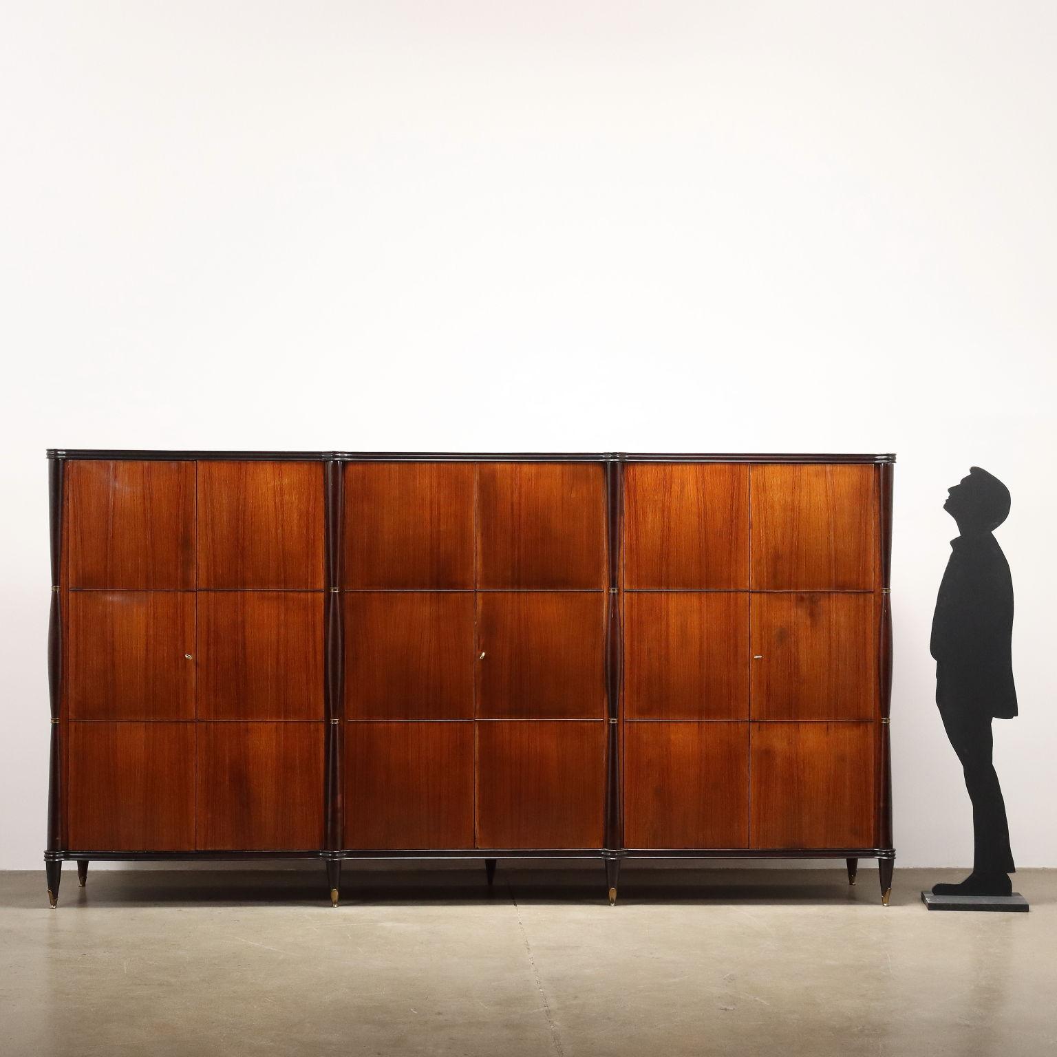 Large vintage Italian-made cabinet made of exotic wood veneer, ebony-stained wood legs, brass ferrules. In good overall condition with some signs of time as visible in photos. 
