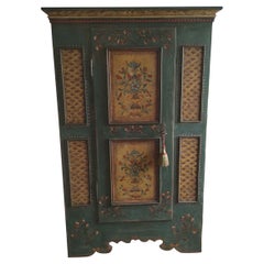 Spruce cabinet with floral painted relief frames
