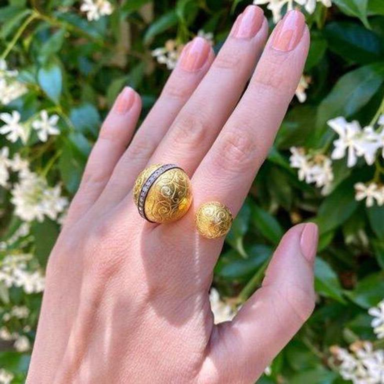 Hand engraved gold sphere ring in 22k gold sphere, 18k gold shank, and oxidizied silver.

Designed and handmade in Los Angeles