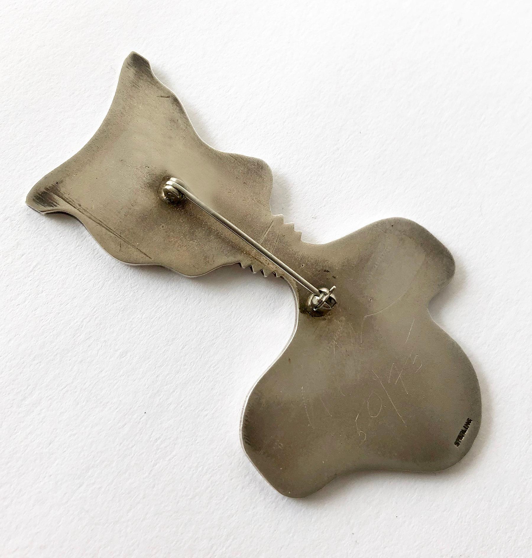 Heavy gauge, highly polished sterling silver pop art brooch by listed artist and sculptor Arman.  Brooch measures 3.5