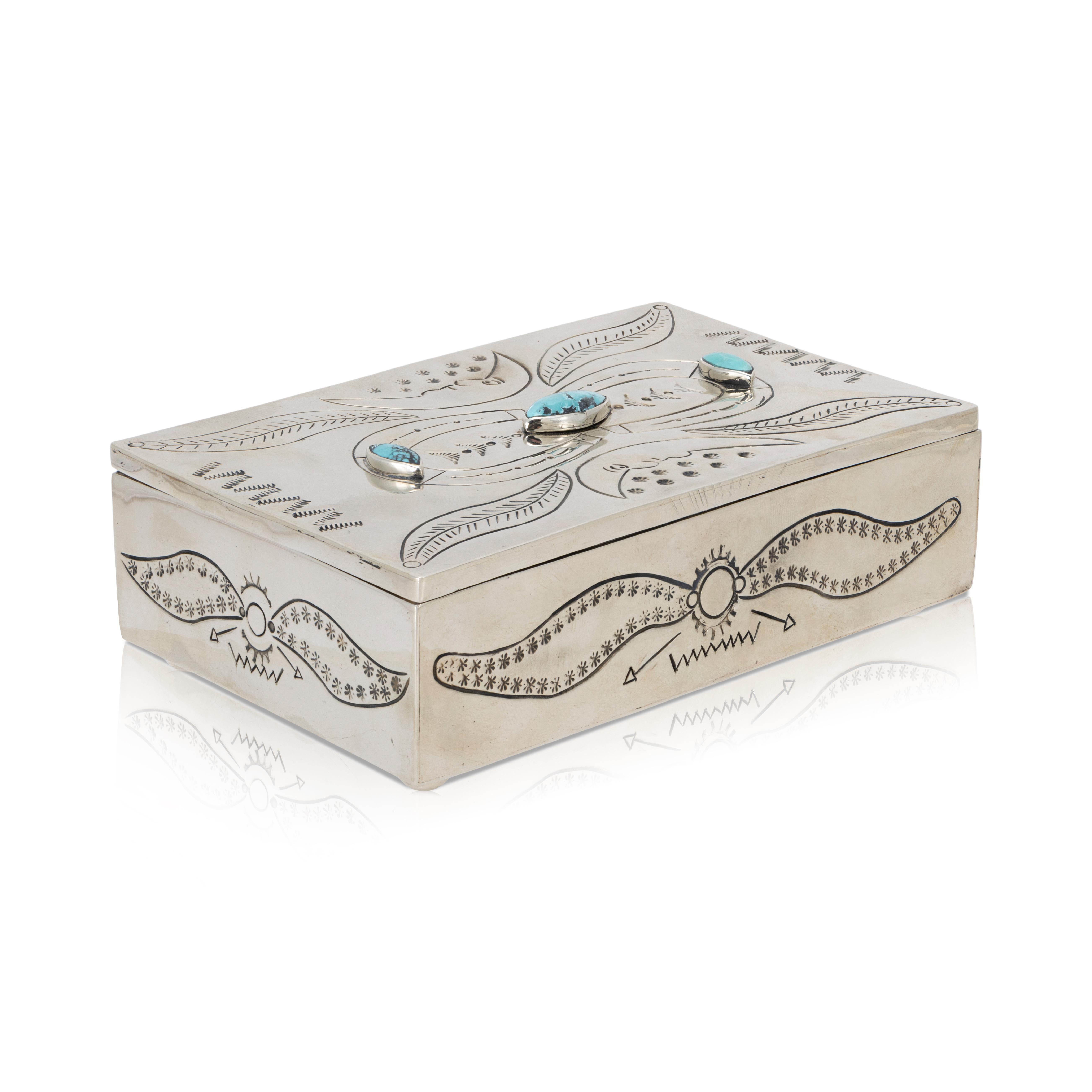 Armand American Horse nickel silver and turquoise jewelry box. Includes moon face motif on lid and hand stamped detail along sides. Stamped on bottom with artist hallmark. Three genuine, natural turquoise stones on lid. 

PERIOD: Late 20th