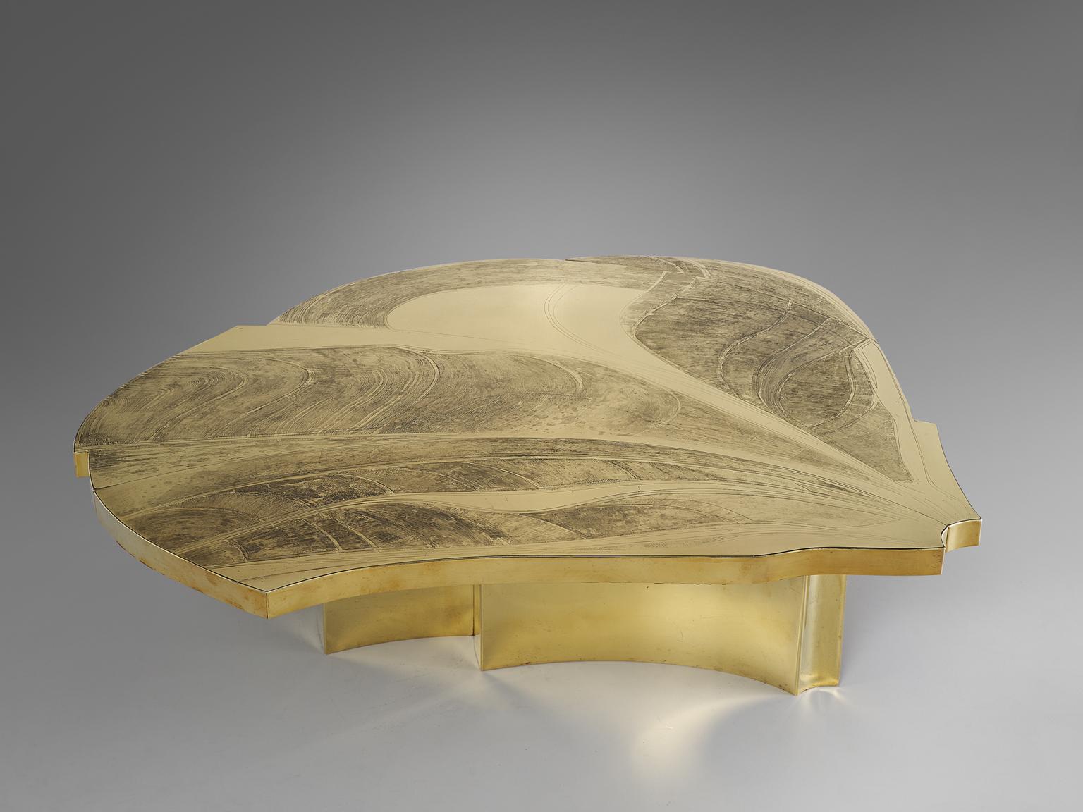 Armand Jonckers, brass etched coffee table, brass, Belgium, 1974

Luxurious Armand Jonckers brass etched cocktail table, featuring a form of a leaf. The surface of the table is hand etched, showcasing different naturalistic curved and waved lines.