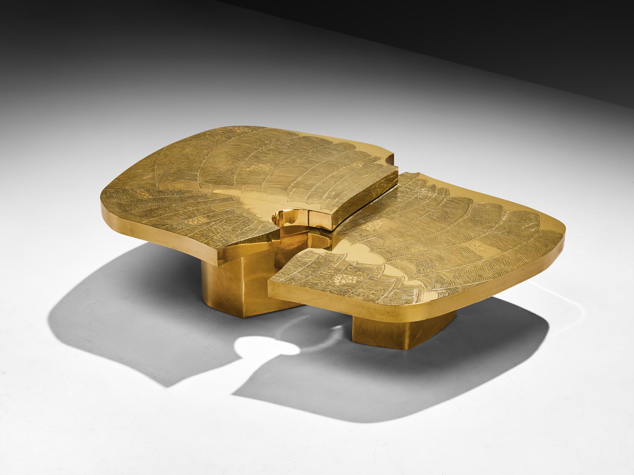 Armand Jonckers coffee table, brass, France, 1970s

This jewel of a coffee table, crafted in brass by Armand Jonckers, embodies the fusion of art and functionality. What immediately stands out are the fluid forms interlocking with one another. Two