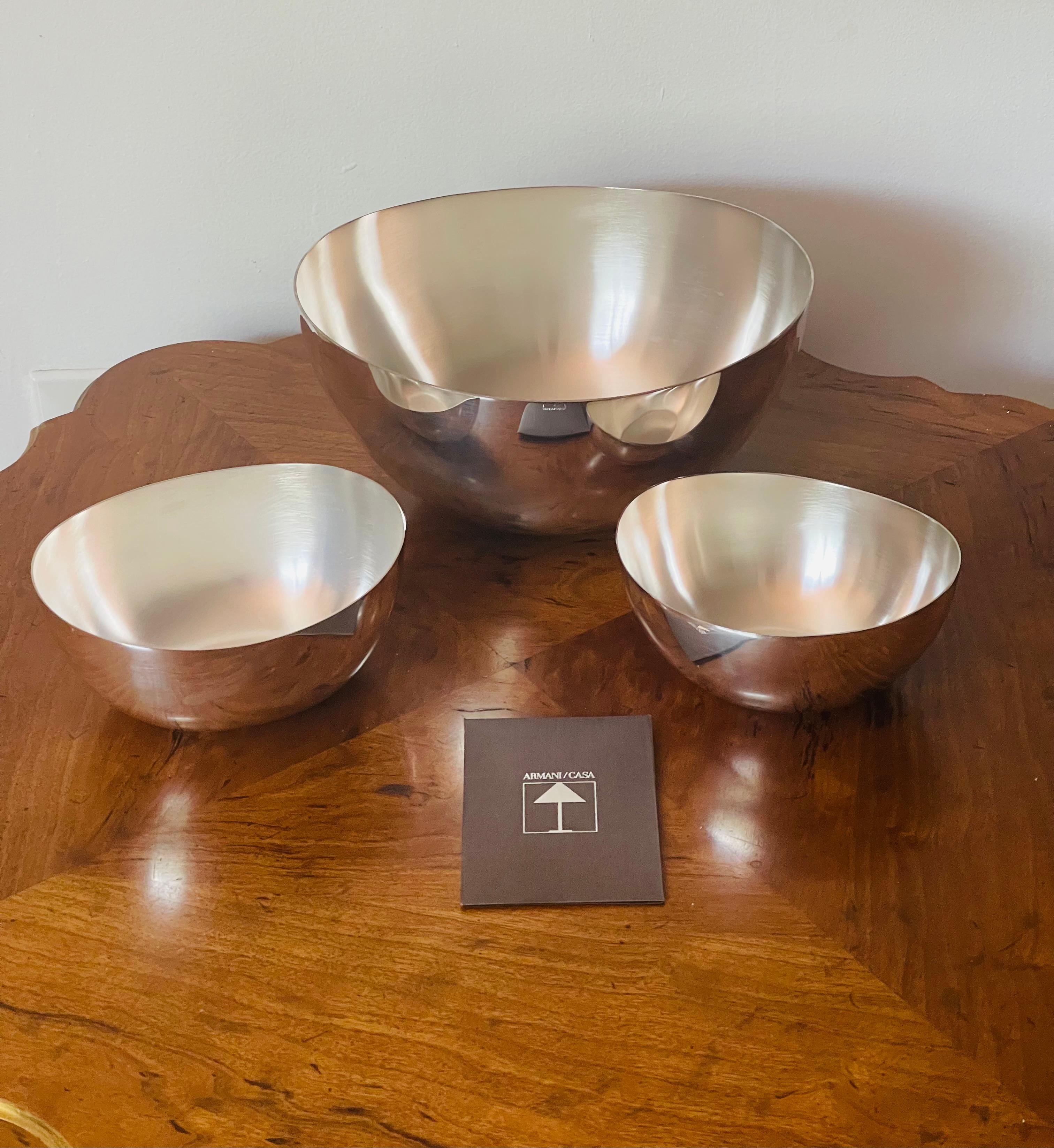 Set of 3 stackable Armani Casa ginger metal bowls. Gloss finish outside and matte inside. Elegant Armani casa design.