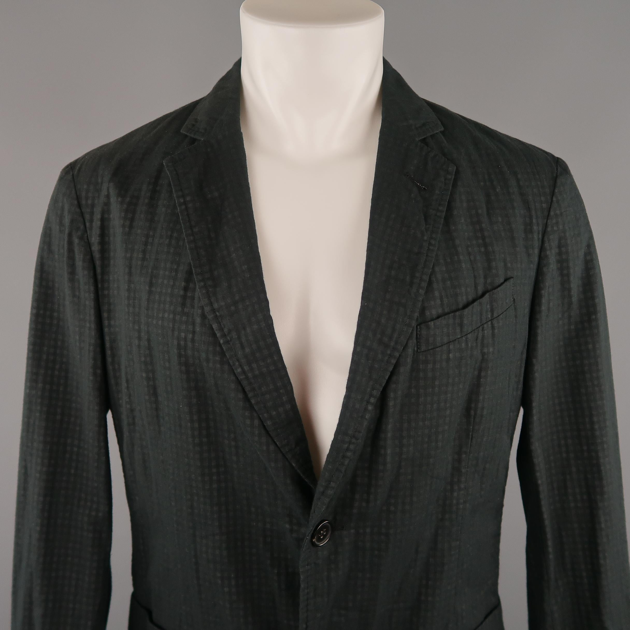 ARMANI COLLEZIONI Sport Coat comes in a black and grey tones in a checkered layered cotton material, with a notch lapel, slit and patch pockets, 2 buttons at closure, single breasted, with functional buttons at cuffs, unlined. Made in Italy.
 
New