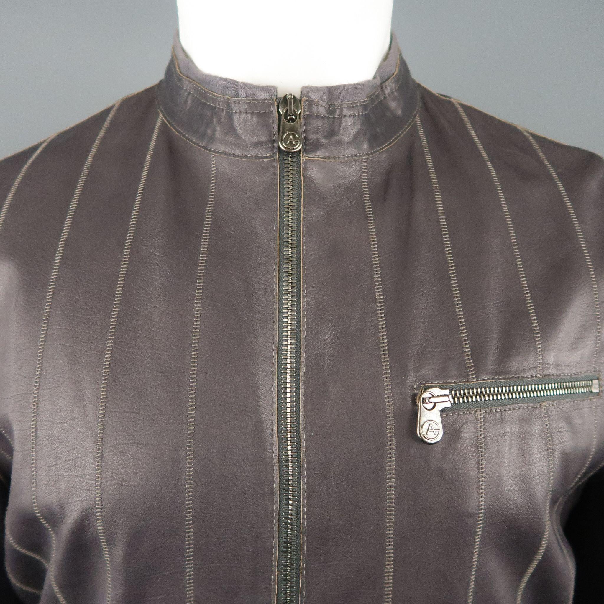 ARMANI COLLEZIONI motorcycle style jacket comes in muted eggplant purple leather with stitched stripe pattern, band collar with knit trim, zip cuffs, and zip pockets. Excellent Pre-Owned Condition. 

Marked:   40 

Measurements: 
 
Shoulder: 18