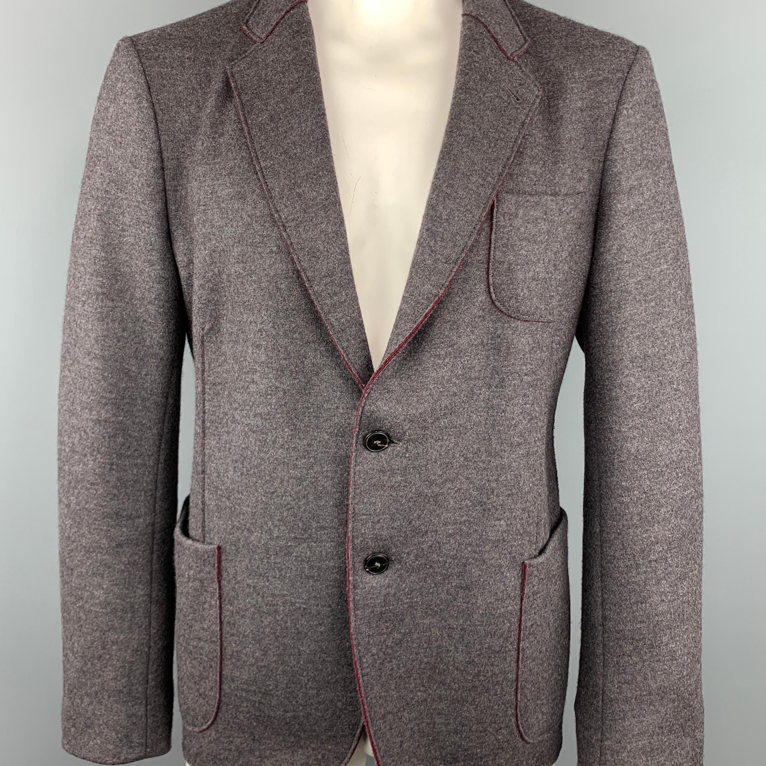 ARMANI COLLEZIONI sport coat comes in a gray wool blend featuring a notch lapel style, two button closure, and front patch pockets.
 
Excellent Pre-Owned Condition.
Marked: 56
 
Measurements:
 
Shoulder: 21.5 in.
Chest: 47 in.
Sleeve: 28 in.
Length: