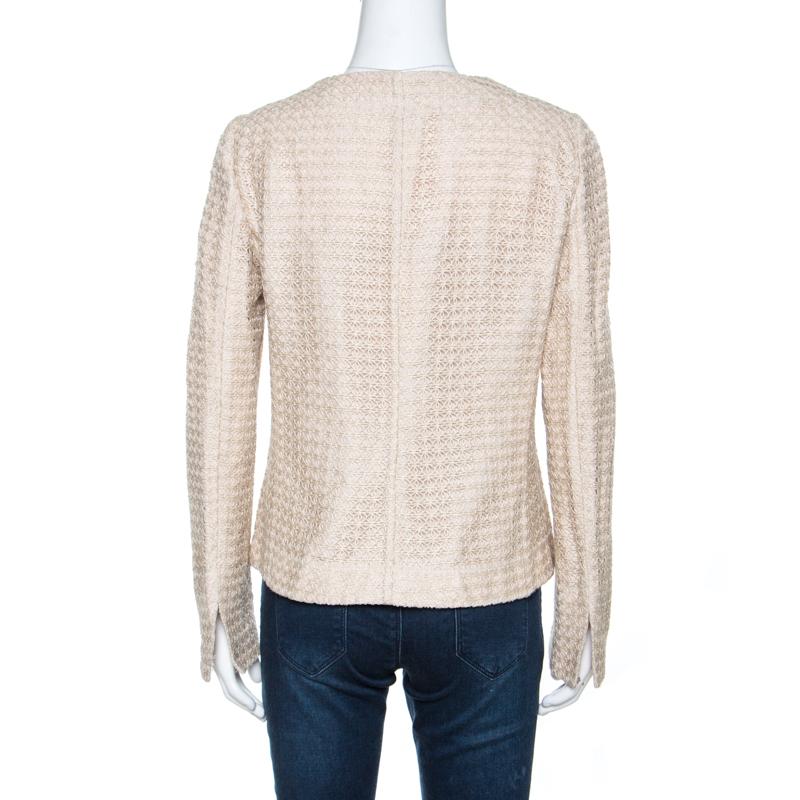 This stylish jacket by Armani Collezioni is great for formal occasions. Crafted from quality materials, it comes in a lovely shade of beige. The jacket features a lace overlay that is intricate and feminine. It is tailored to perfection and styled