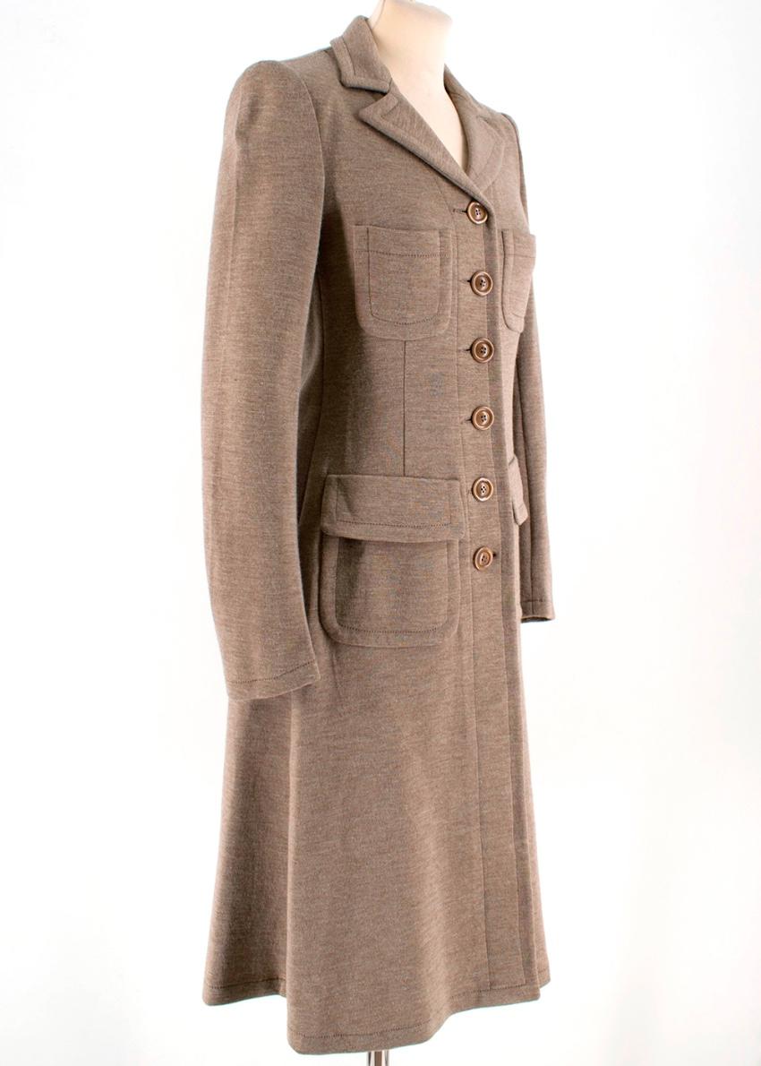 Armani Collezioni Beige Wool Duster Coat

- button up fastening 
- notched collar
- two open pockets at the chest
- two flap pockets at the waist 
- slightly padded shoulders
- long sleeve
- straight slim fit

- 80% Wool, 20% Nylon
- dry clean only