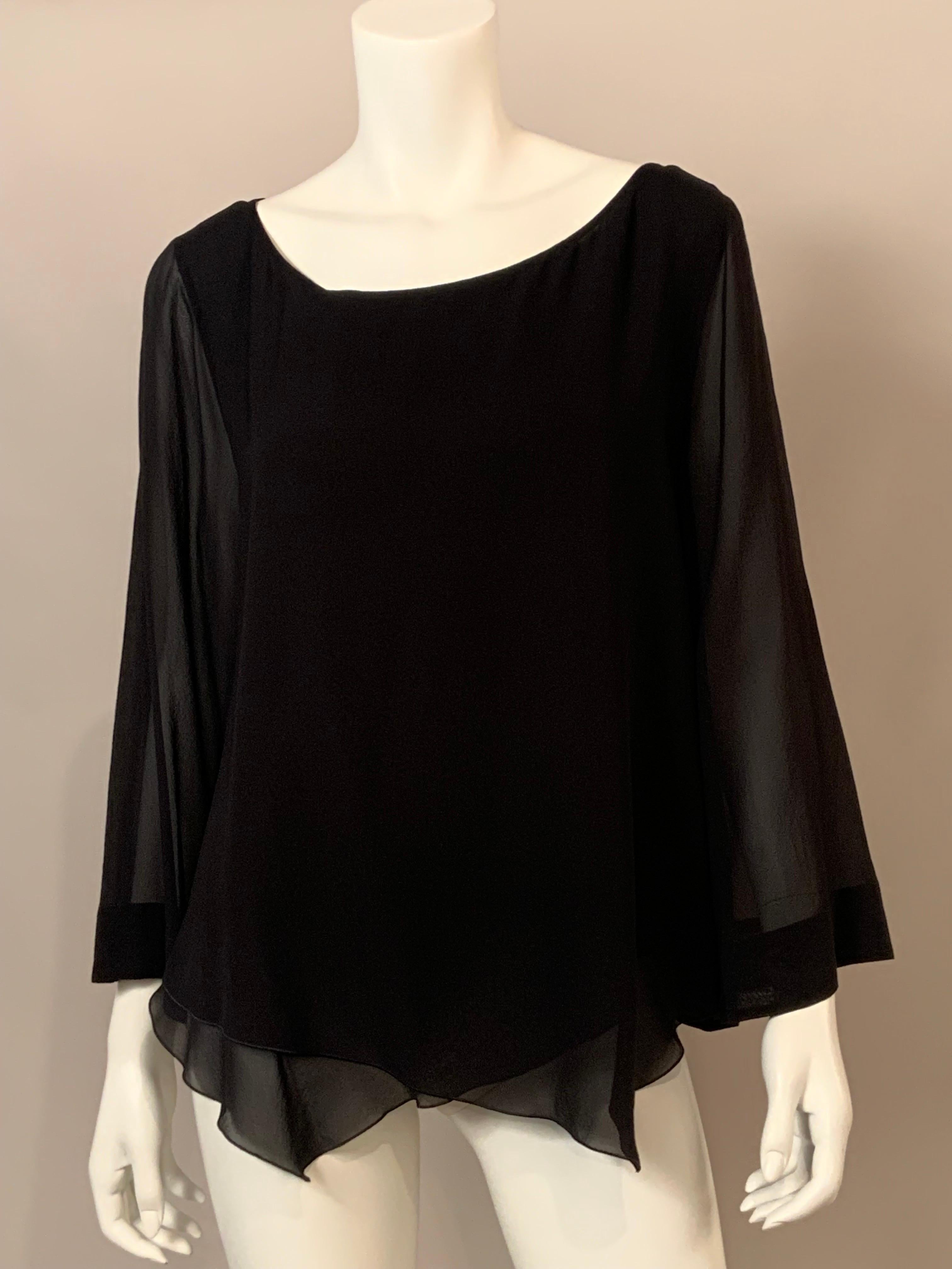This elegant black silk chiffon tunic top from Giorgio Armani is so feminine.  The body is made from two layers of silk chiffon with a pointed hemline and the sleeves are a single layer of chiffon.  It goes on over your head, no closures, just