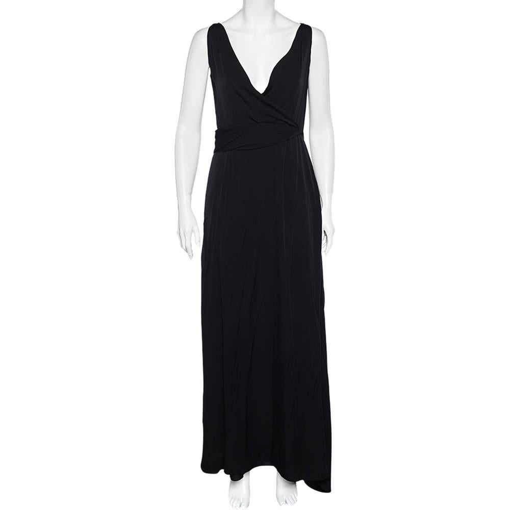 Make an impressive style statement as you step out wearing this beautiful dress from Armani Collezioni. Stitched using black silk fabric, this maxi dress is accentuated with a stunning décolletage and a slit at the back. It shows a sleeveless style