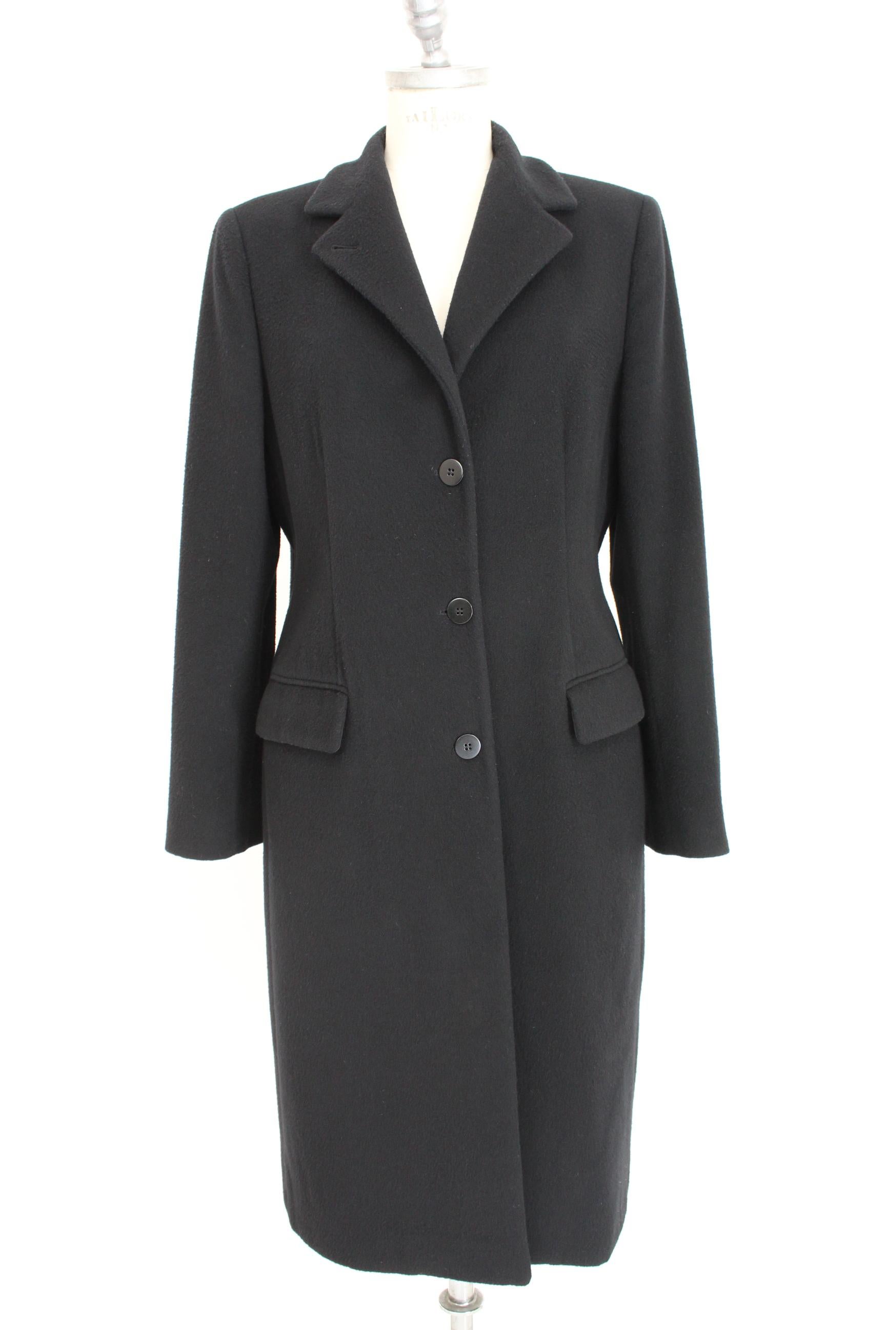 Armani Collezioni 90s vintage women's coat. Classic long model, high collar. Black color, 100% wool. Made in Italy. Excellent vintage conditions.

Size: 48 It 14 Us 16 Uk

Shoulder: 48 cm

Bust / Chest: 52 cm

Sleeve: 60 cm

Length: 114 cm