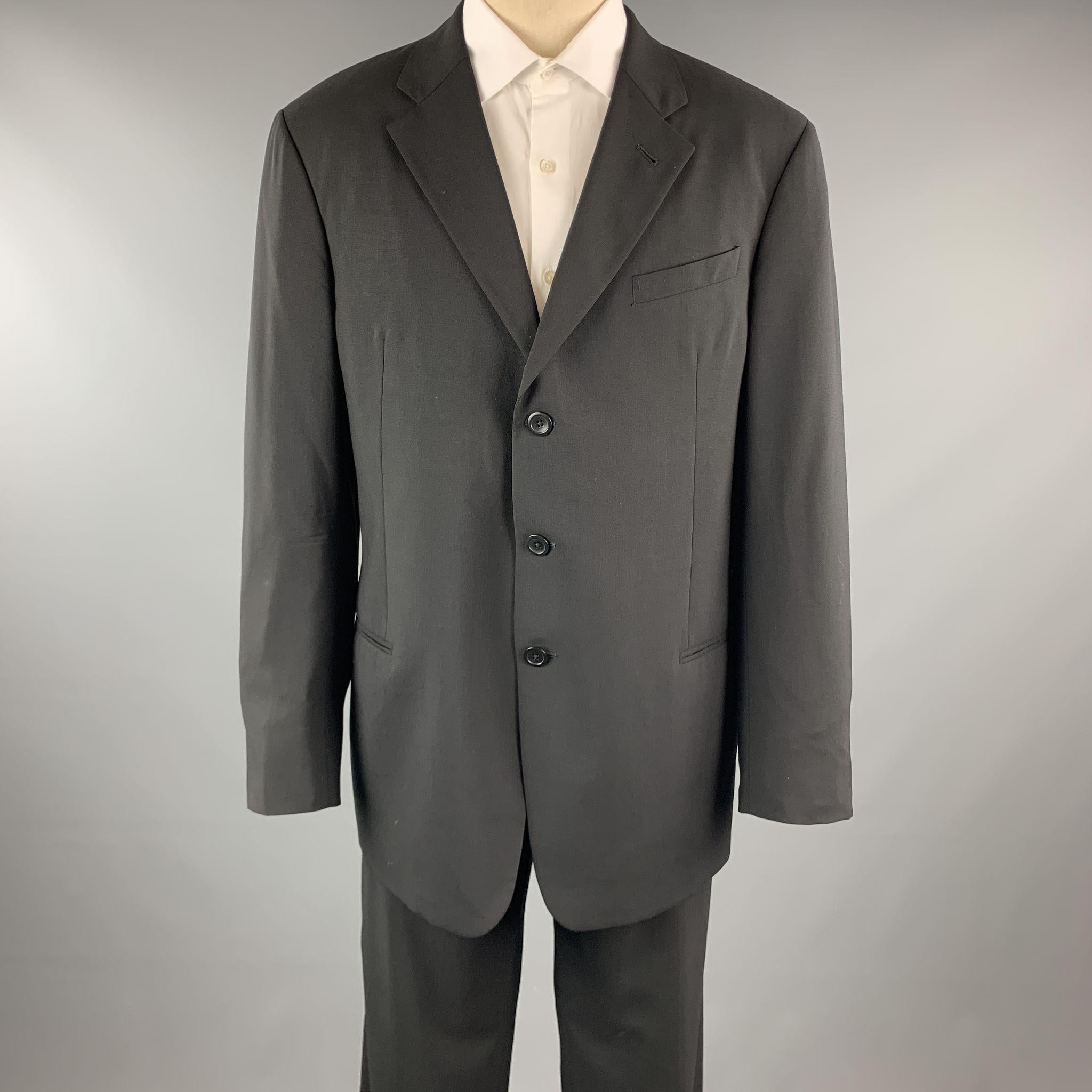 ARMANI COLLEZIONI suit comes in a black wool and includes a single breasted, three button sport coat with a notch lapel and matching front trousers. Made in Italy.

Excellent Pre-Owned Condition.
Marked: 55

Measurements:

-Jacket
Shoulder: 19.5 in.