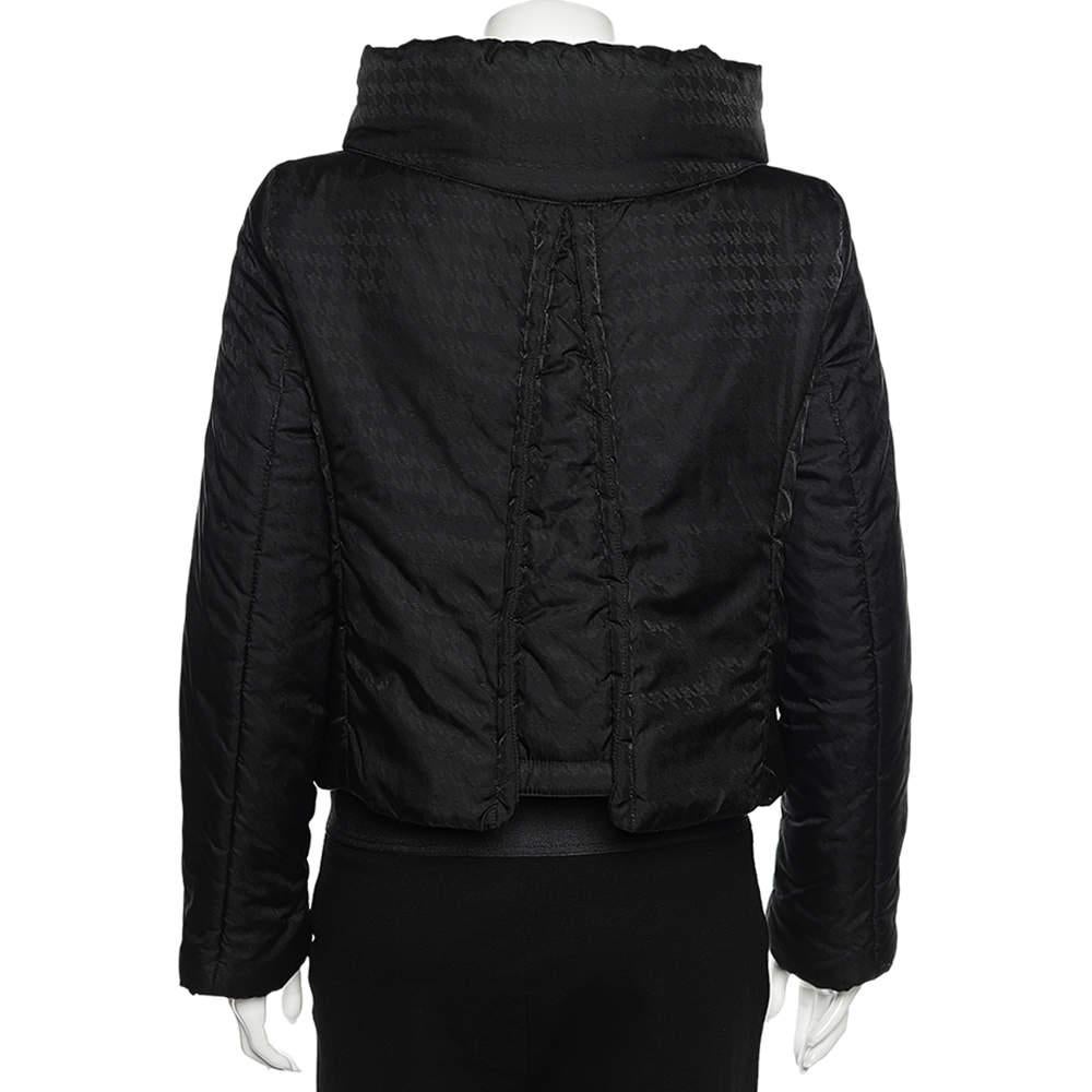 Stay warm and look trendy all winter as you wear this jacket from the House of Armani Collezioni. It has been designed using black synthetic fabric and comes with a concealed hood detail, zip-front, and two pockets. Smartly tailored and convenient,