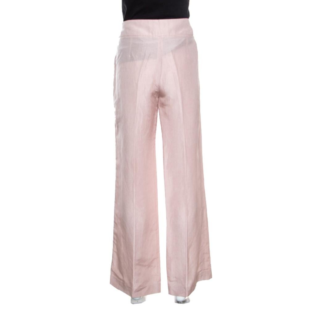 Versatile creations are the hallmark of Armani Collezioni and these blush pink pants are no exception! They are made of 100% linen and feature a high waist and wide leg silhouette. They come equipped with a zip closure and can be paired well with a