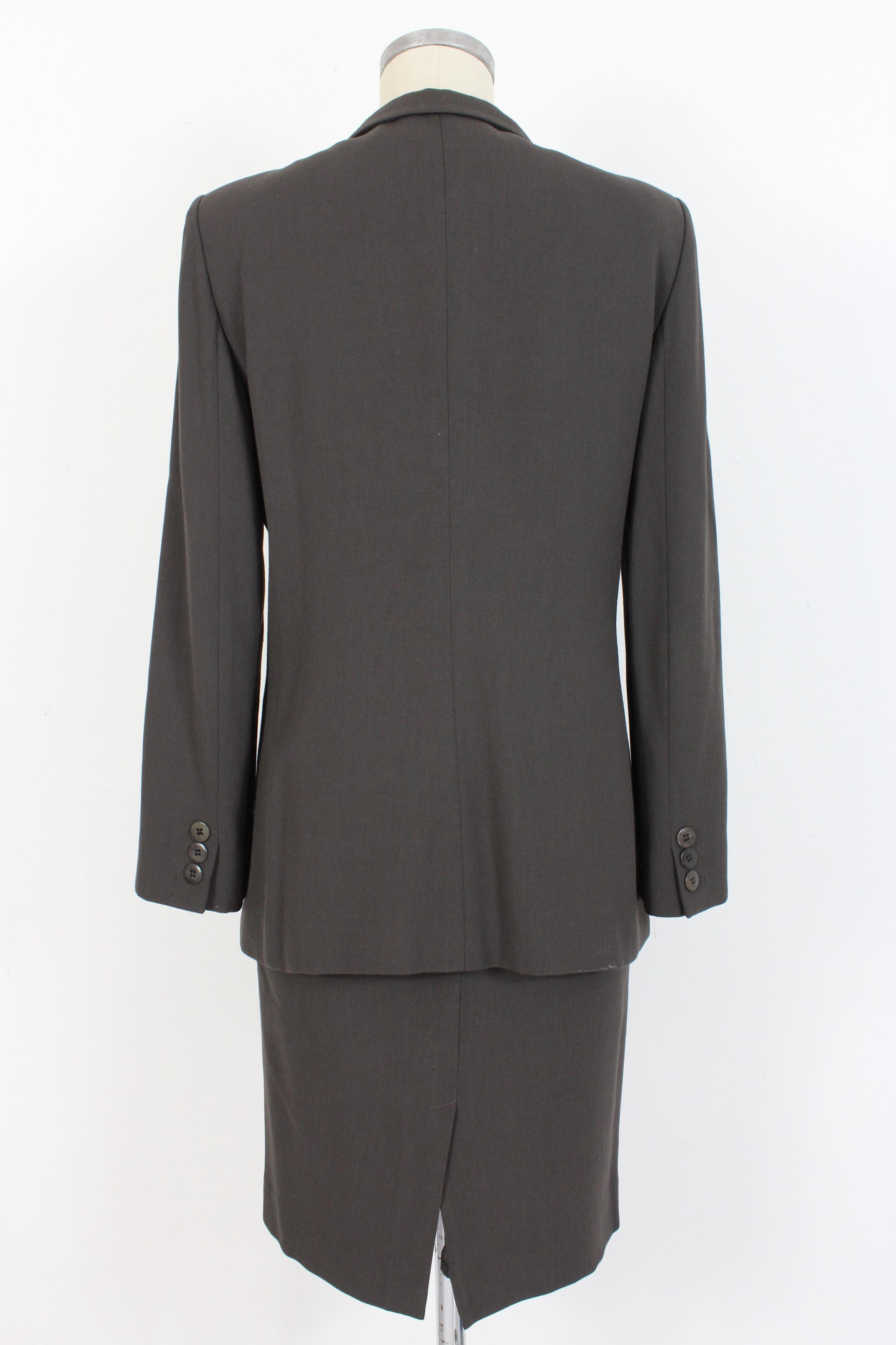 Armani Collezioni 90s vintage women's suit skirt. Classic dark gray suit. Lined jacket with applied shoulder pads, pencil skirt. The skirt and jacket have different sizes, read the measurements well. Made in Italy.

Condition: Excellent

Article