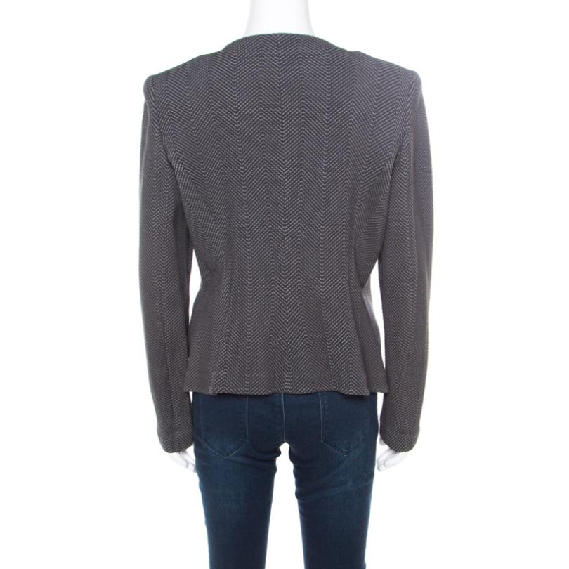 Modishly crafted, this jacket from Armani Collezioni would make you the center of attention of any event. This comfortable grey piece is going to be your companion for the years to come. It has long sleeves, floral applique and ruffled trim on the