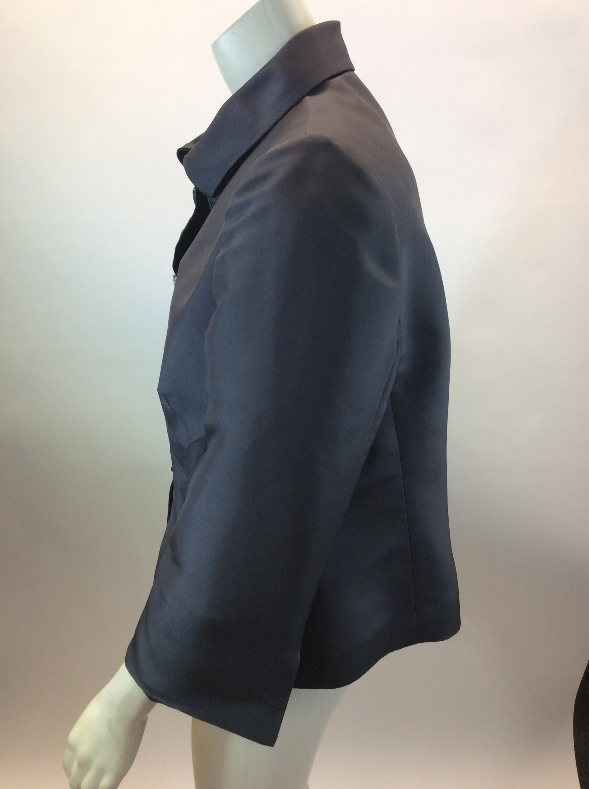 Armani Collezioni Grey Silk Jacket
$199
Made in China
100% Silk
Size 12
Length 21.5